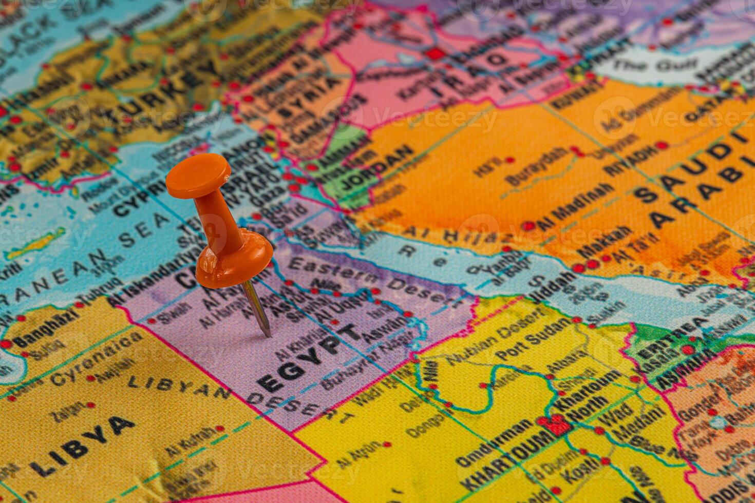 Exploring Egypt on a colorful map with a pushpin photo