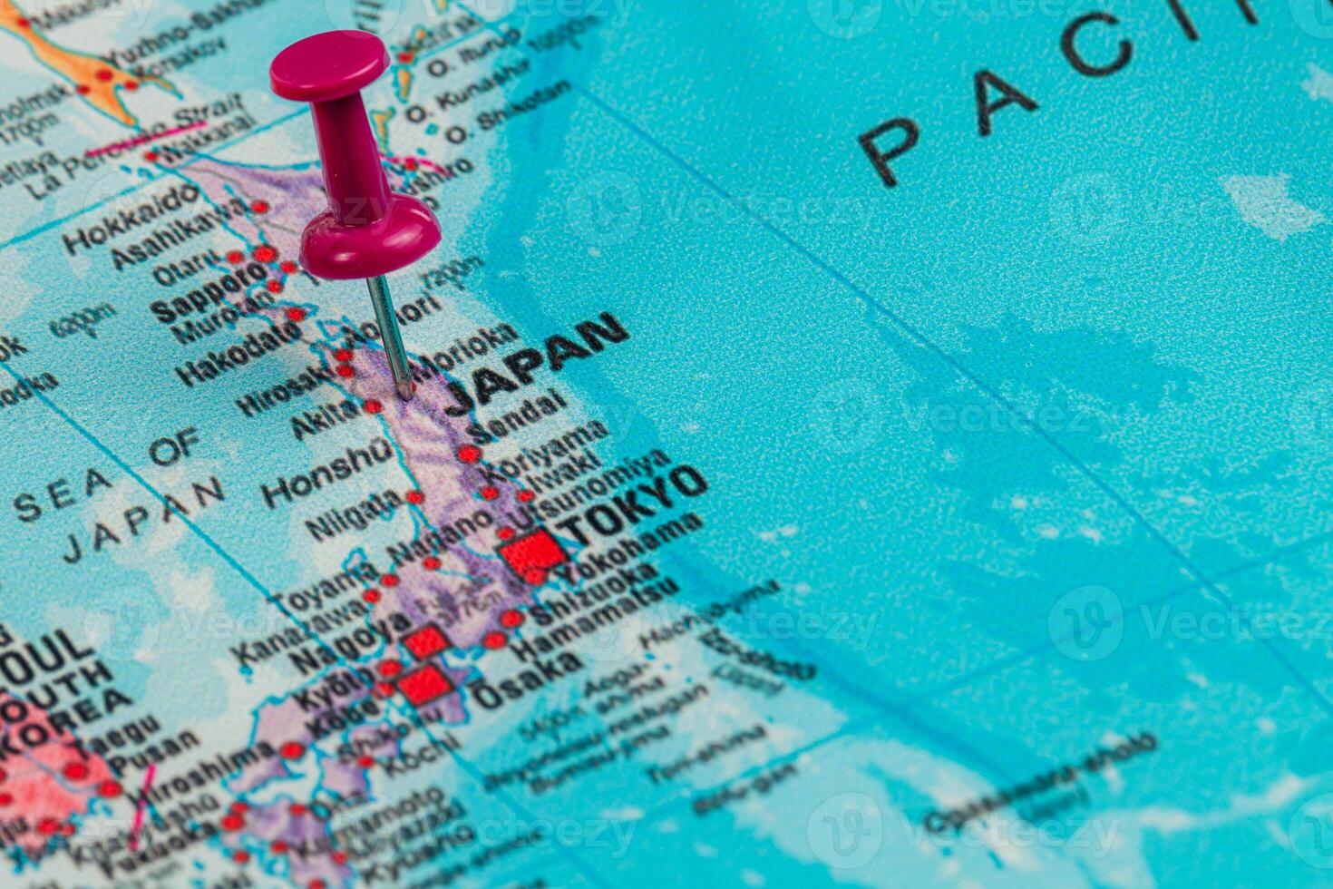 Discovering Japan on a colorful map with a pin marking Tokyo photo