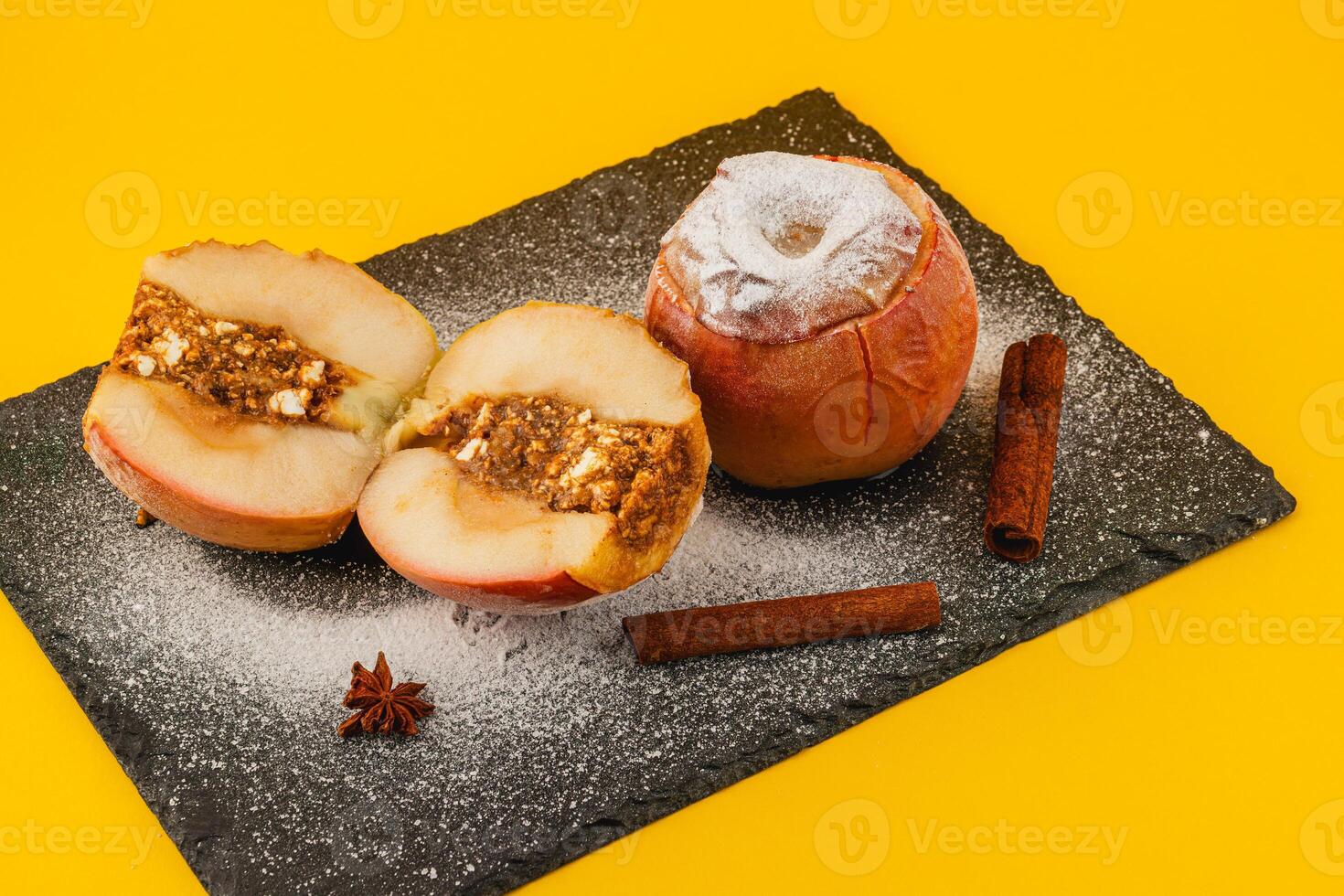 Delicious baked apples with cinnamon and nut filling photo