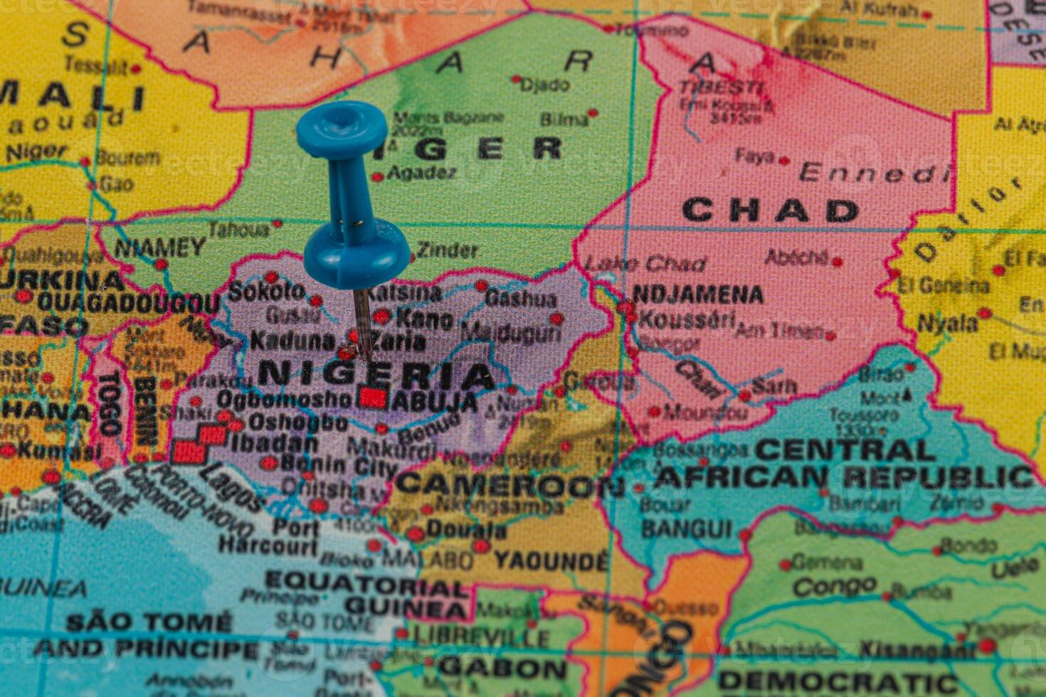 Location pin highlighting Nigeria on a colorful map photo