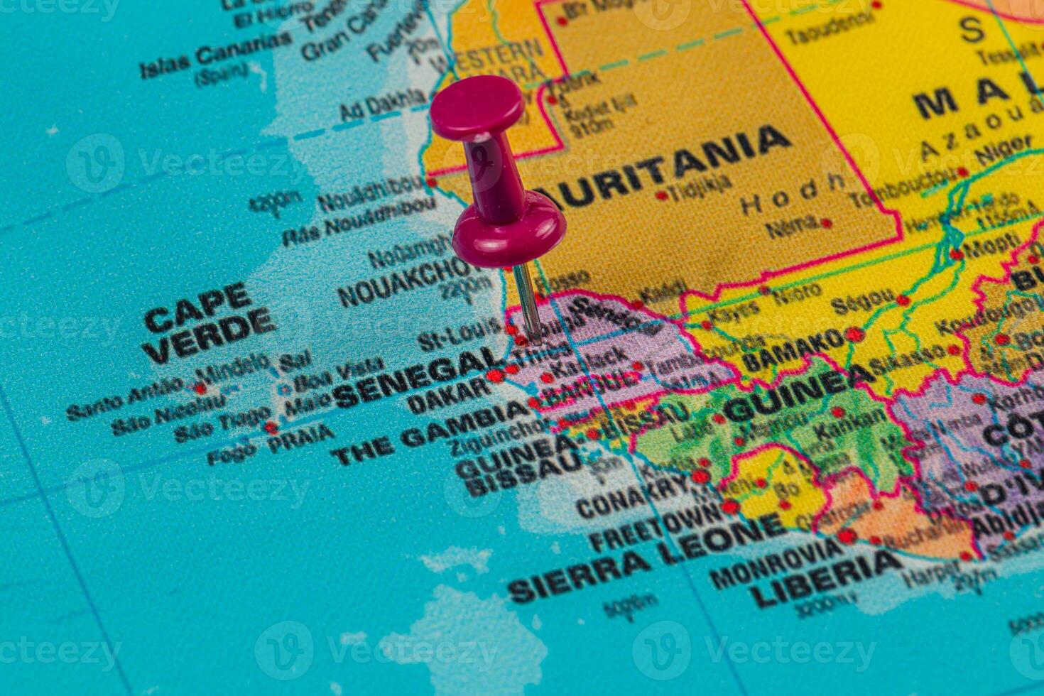 Pinpointing Dakar on a colorful map of West Africa photo
