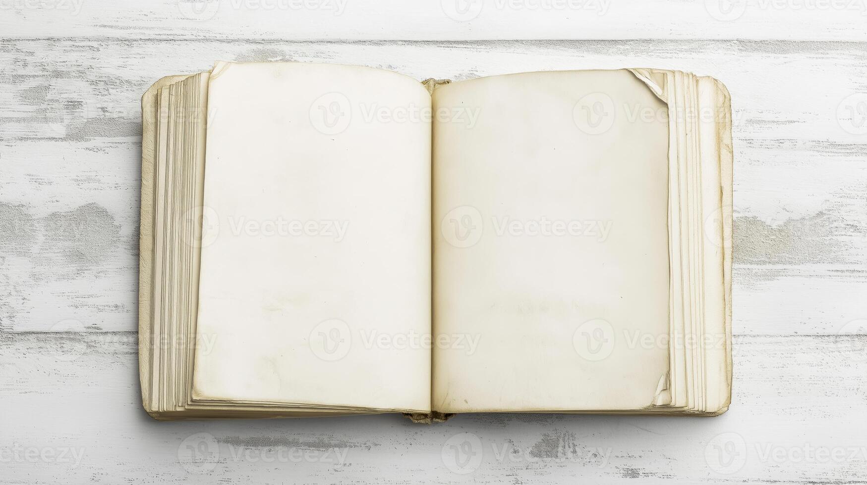open book or magazine lying on a white wooden surface. The book appears to be blank, with no text or images on the pages. photo