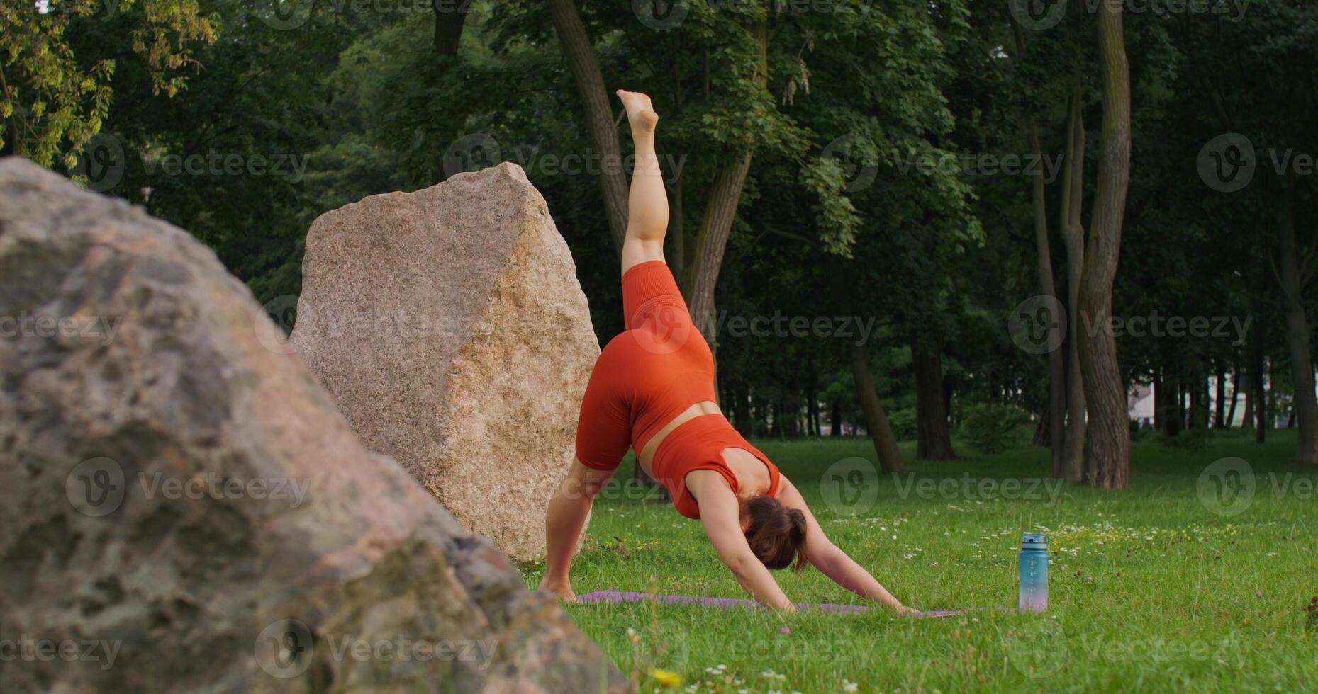 Sports during pregnancy. A woman in late pregnancy in sports clothes is doing Pilates photo