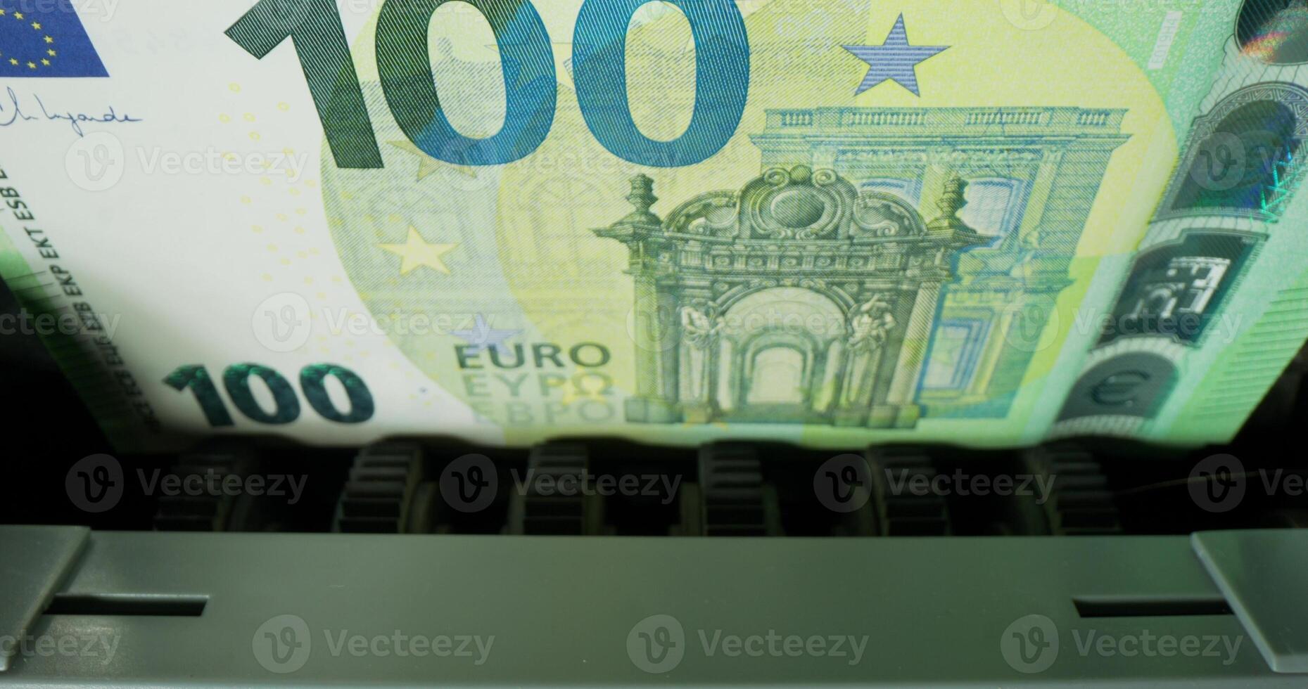 One hundred euro banknotes during counting in the counting machine. The currency of the European Union. photo