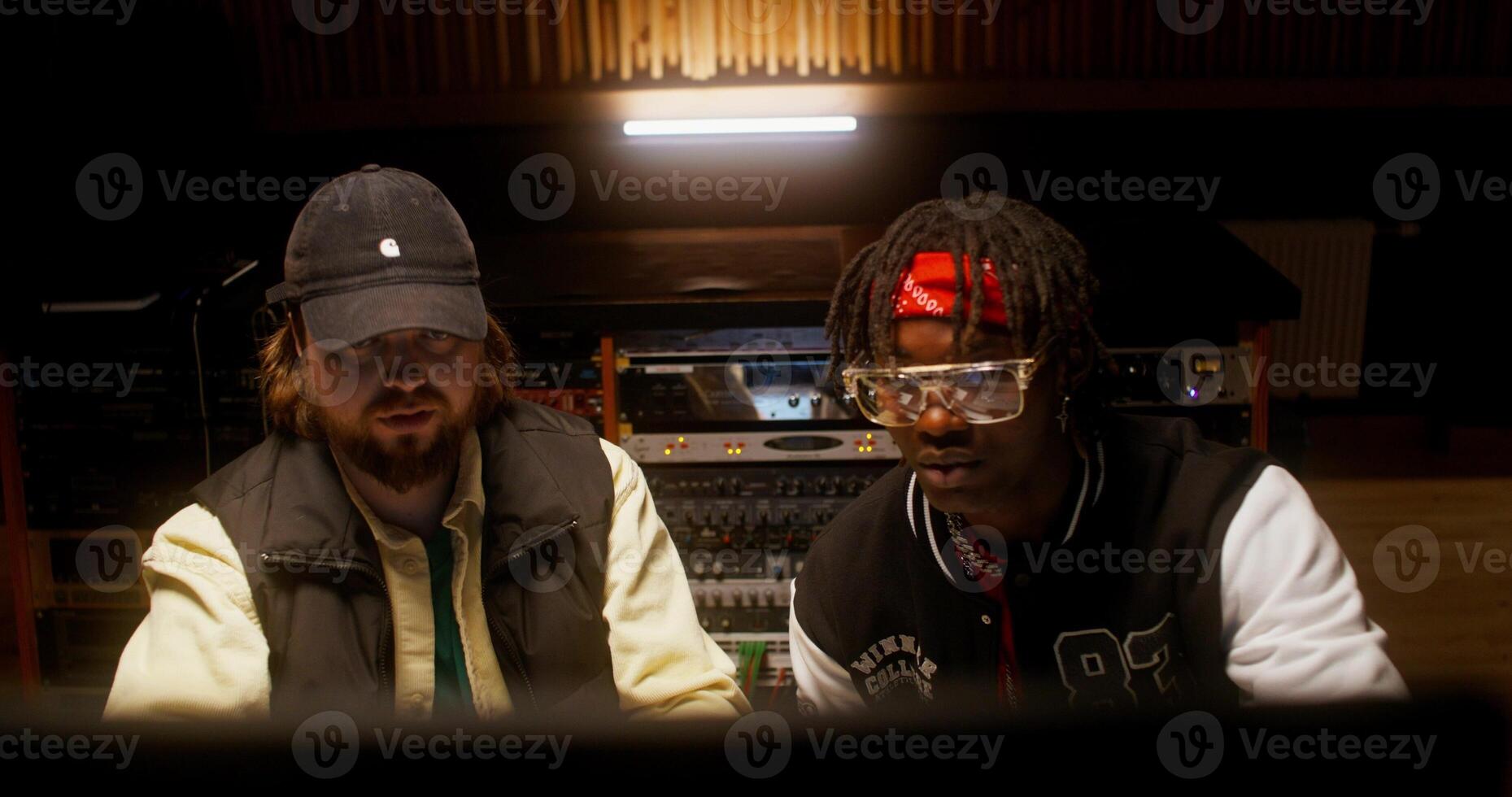 Listening to the song after recording in the studio. photo