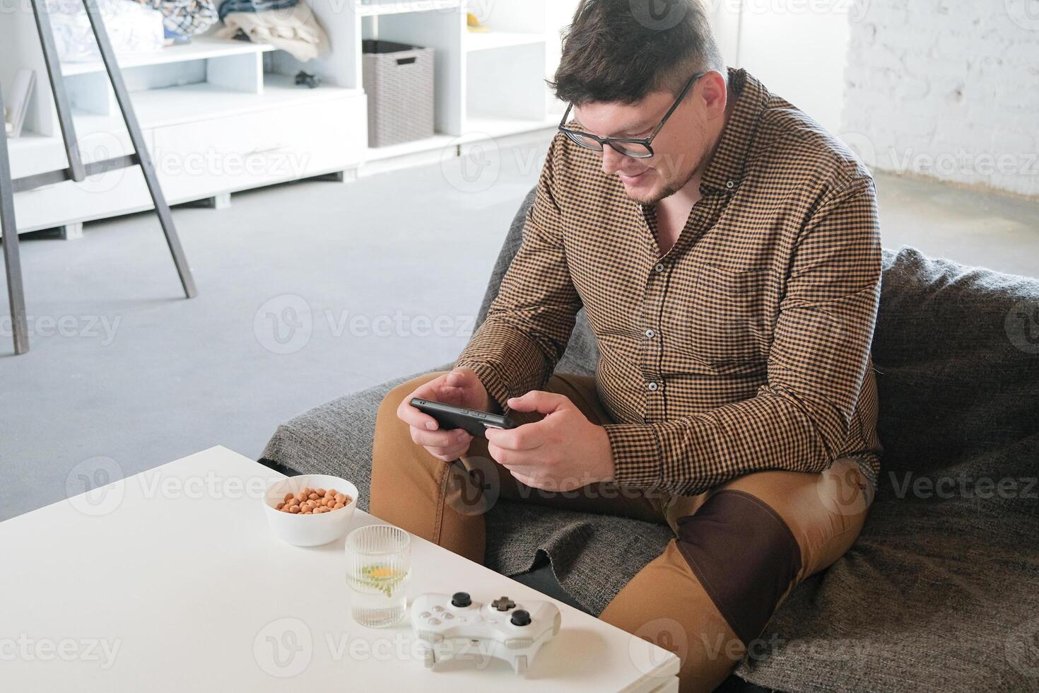 Caucasian man have live stream and win mobile game on the smartphone at home photo