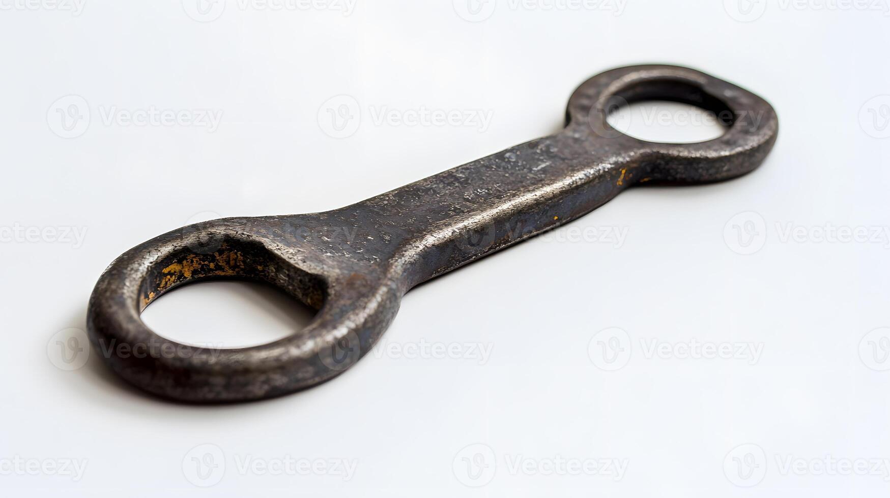 A wrench is shown on a white surface photo