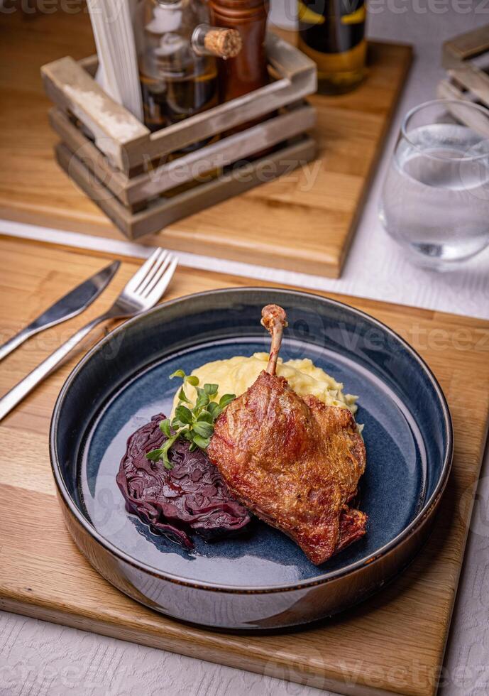 Roasted duck leg confit photo