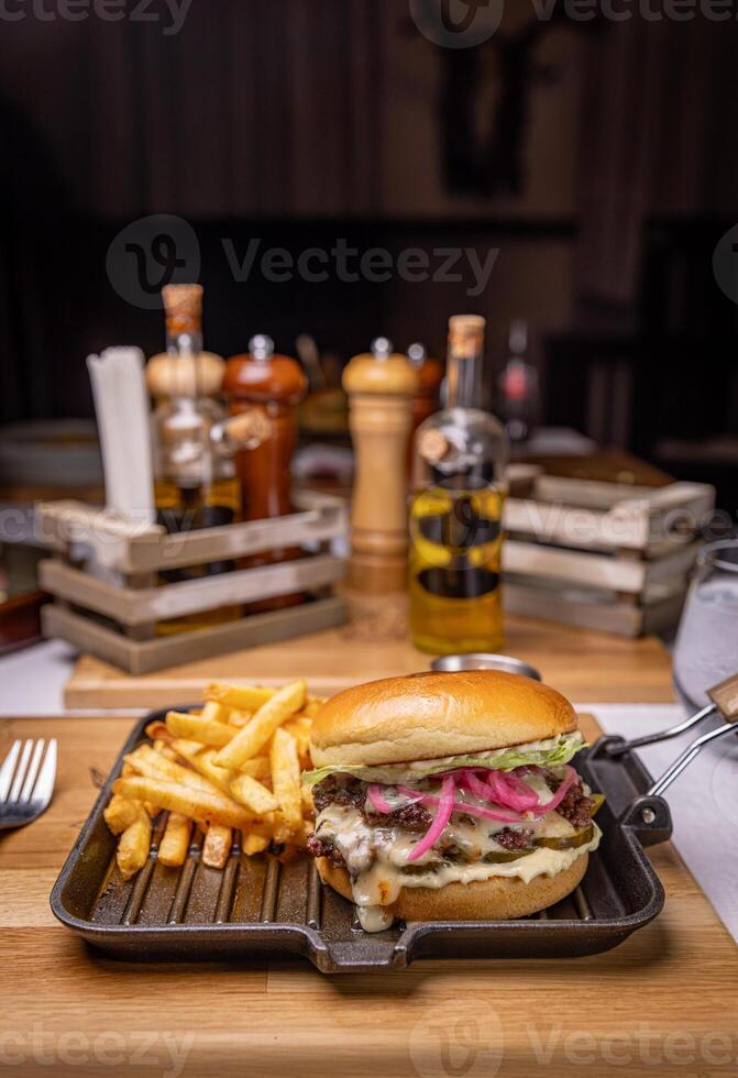 Delicious burger with french fries photo