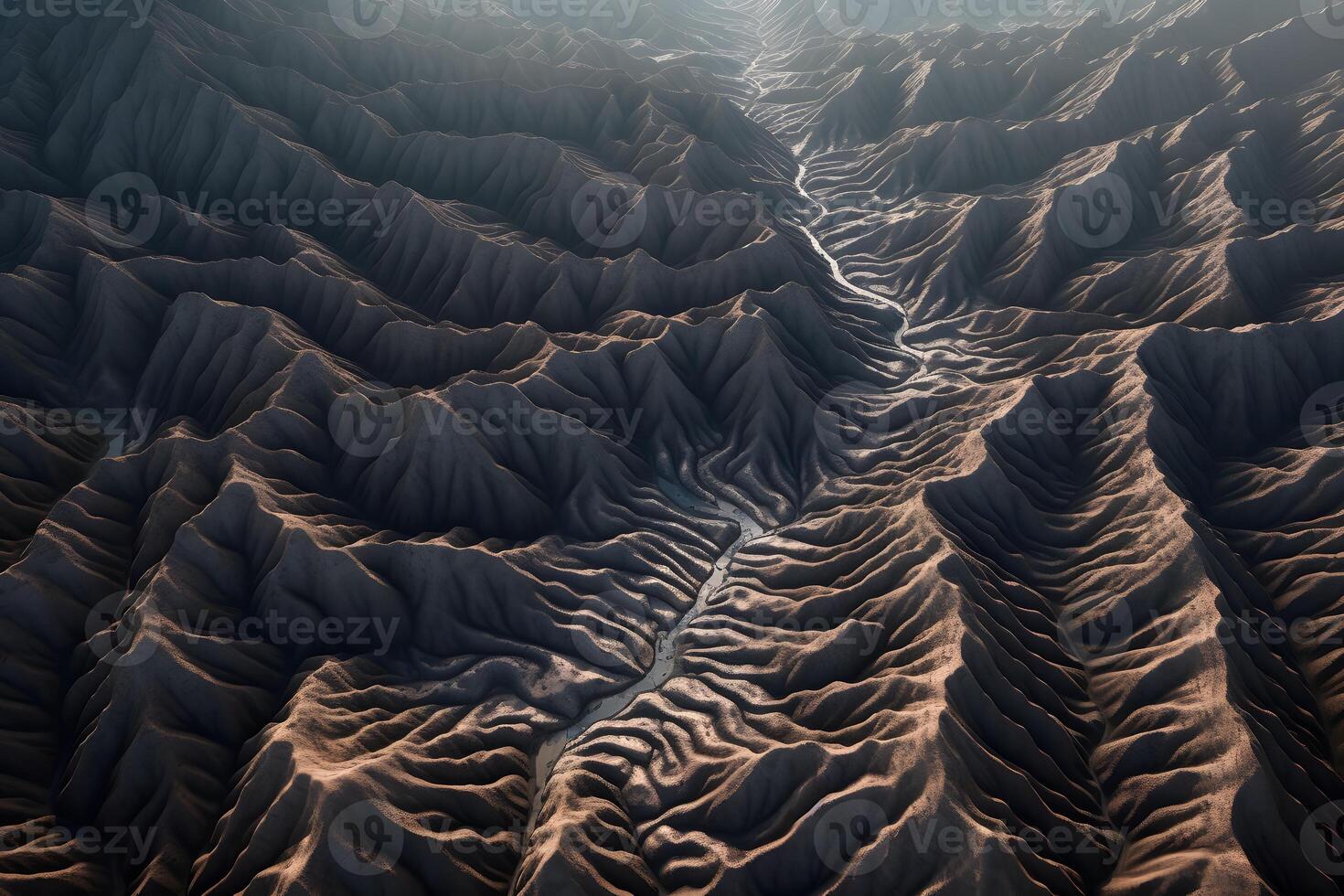 An aerial view of a mountain range with a river photo