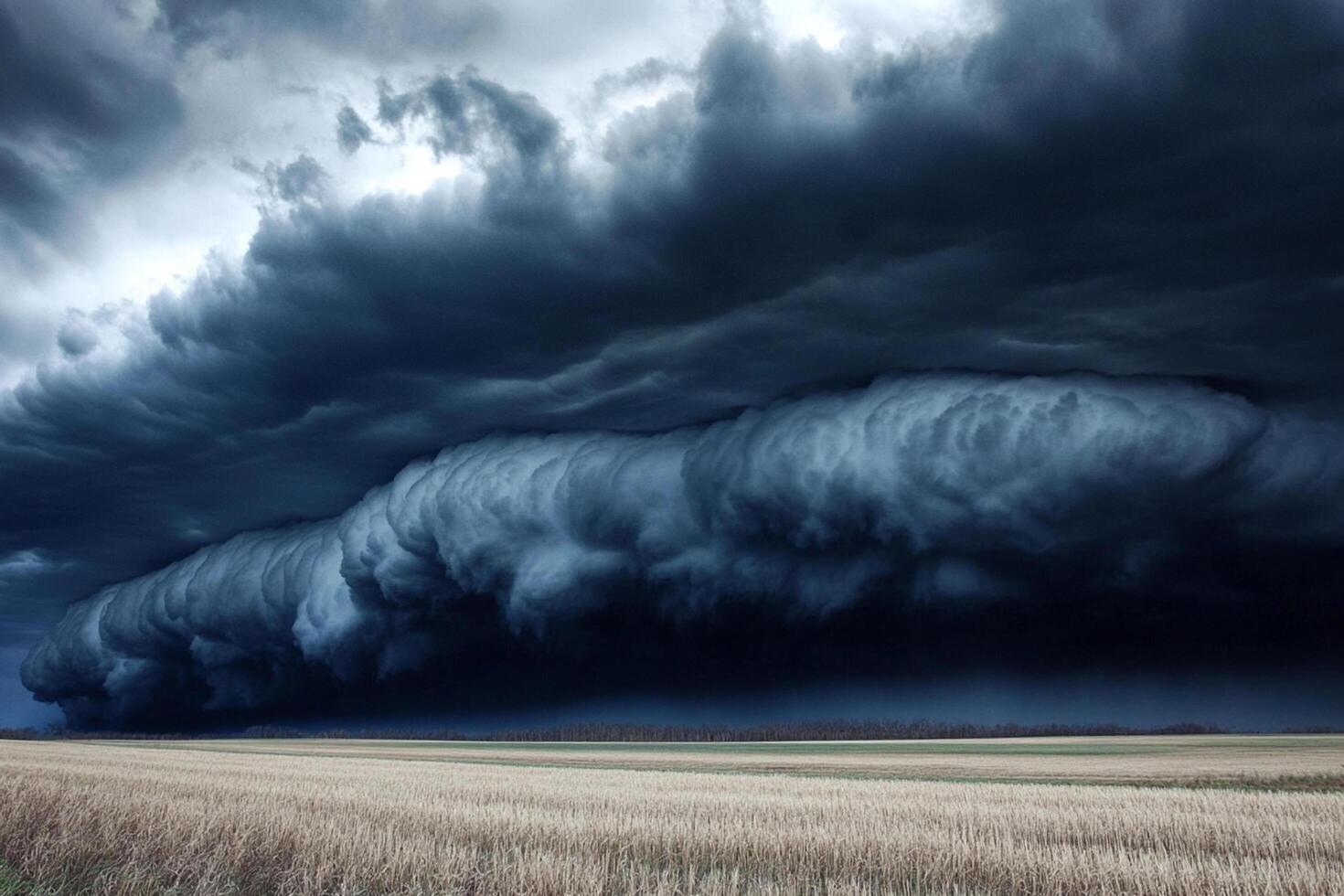 Dramatic storm clouds rolling over an open field at twilight in a rural landscape photo