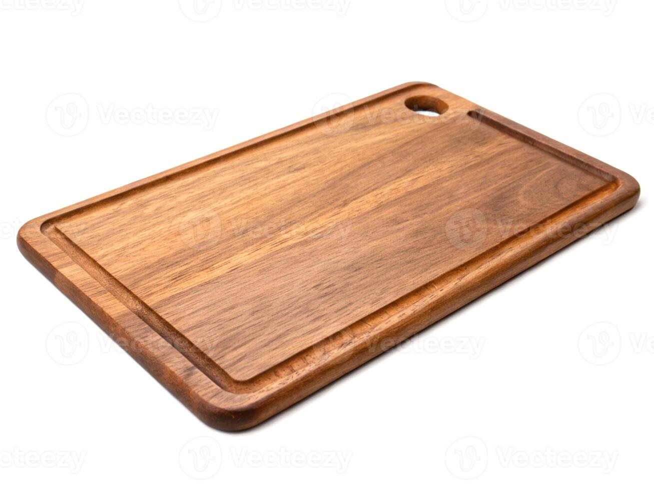 Rectangular acacia wood cutting board with handle hole photo