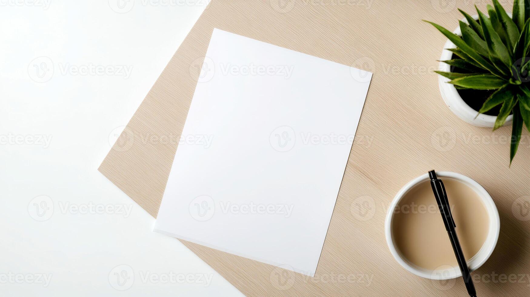 Blank white sheet rests on a wooden desk, accompanied by a coffee cup and a small green plant, creating a calm workspace atmosphere photo