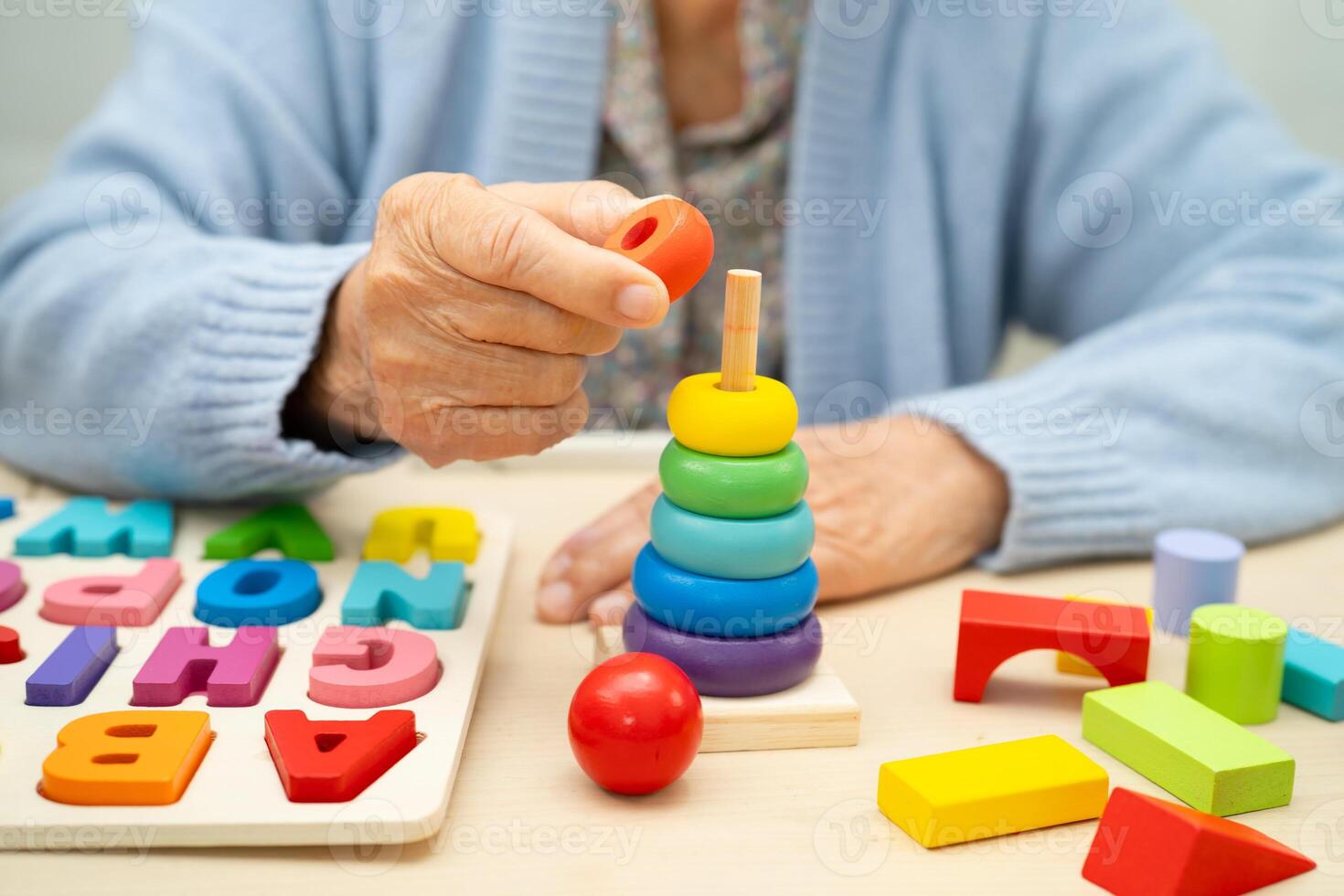 Alzheimer disease AD Asian elderly woman patient suffering from dementia learn practical motor skills photo