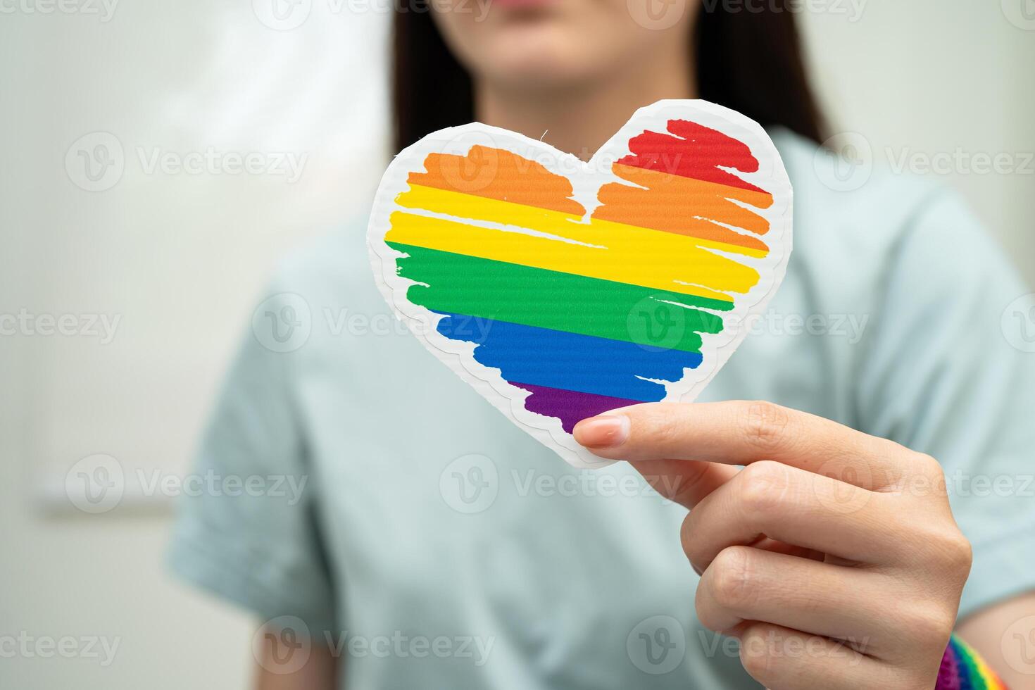 lady wearing rainbow flag photo