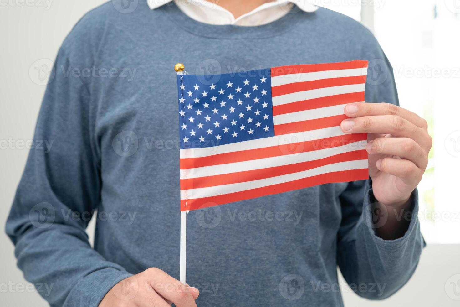 Learn English language, Asian teenage student hold US America flag in course at school. photo