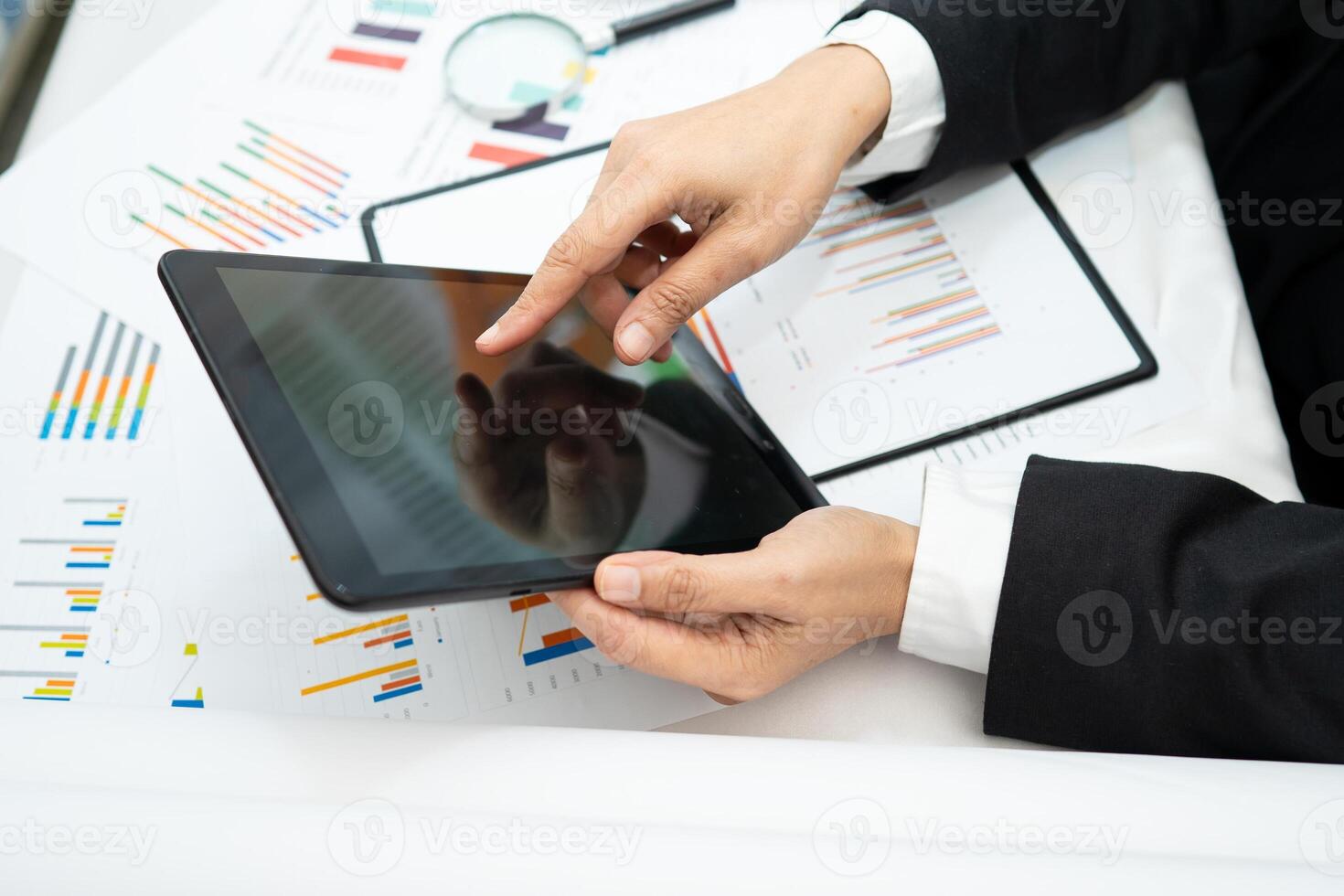 accountant working and analyzing financial reports project accounting with chart graph and calculator in office photo