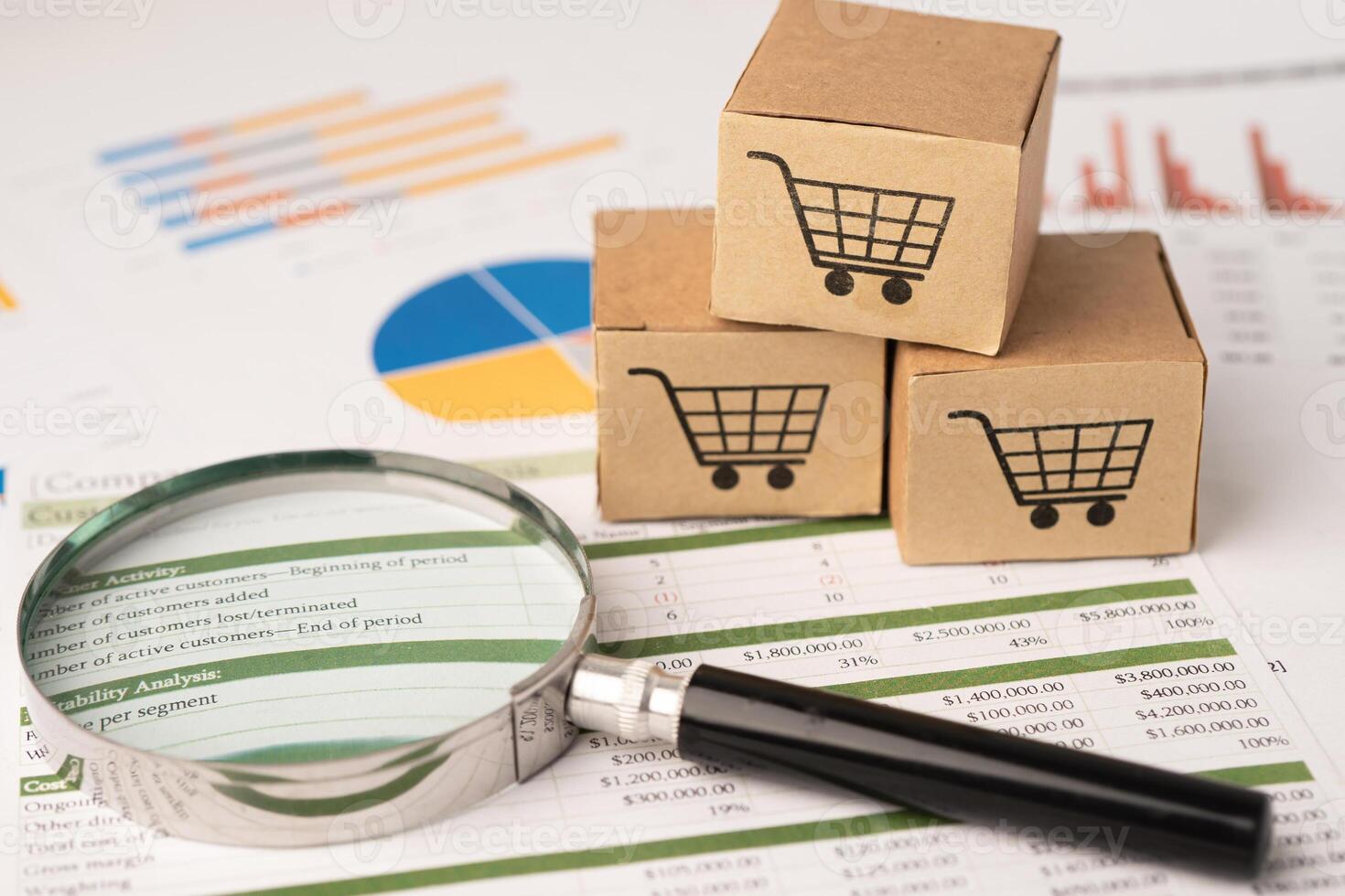 Shopping cart logo on box with magnifying glass on graph background. Banking Account, Investment Analytic research data economy, trading, Business import export transportation online photo