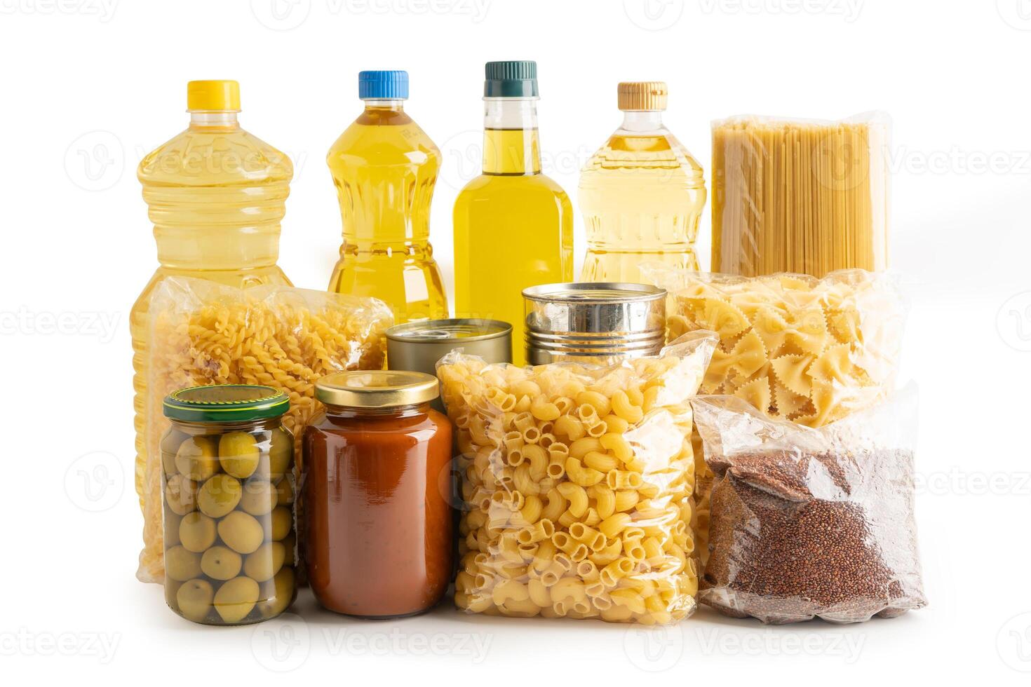 Foodstuff for donation isolated on white background with clipping path, storage and delivery. Various food, pasta, cooking oil photo