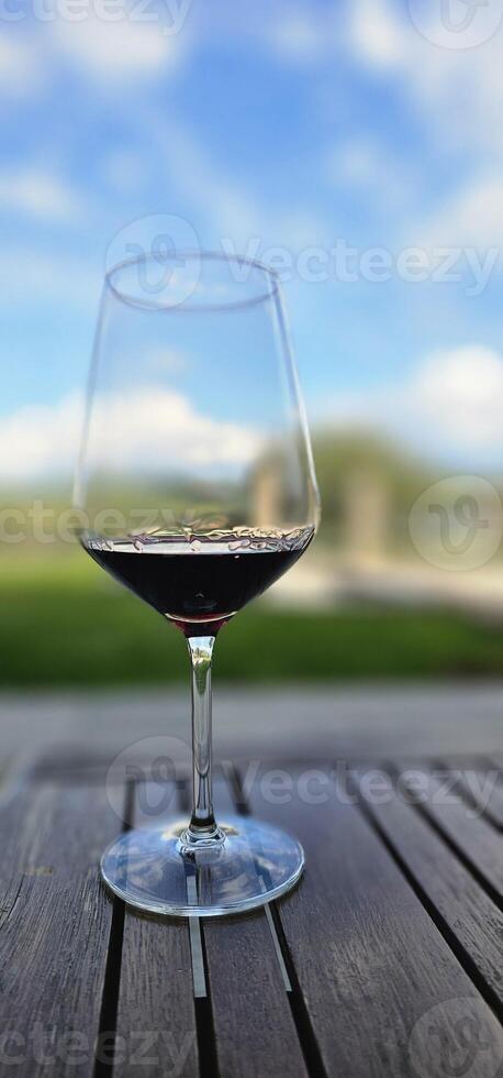 glass of red wine drunk in a cellar in the Piedmontese Langhe during a food and wine dinner photo