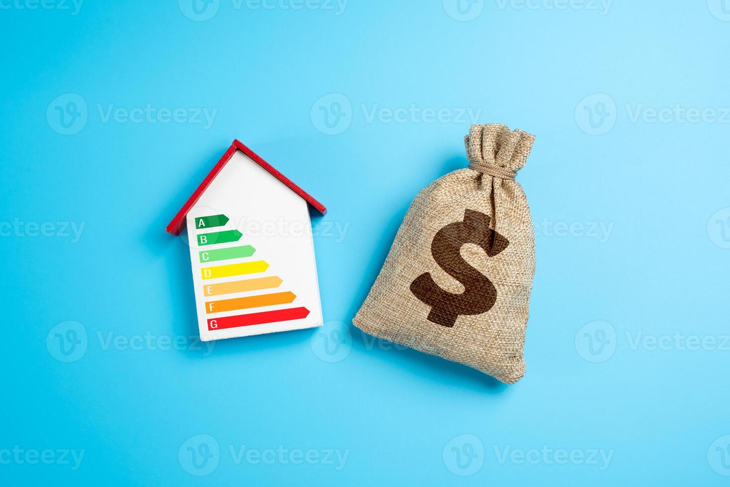 House with energy efficiency scale and dollar money bag. Saving budget money by saving energy. Investments in eco-friendly housing and autonomy. Smart home improvements. Utility savings photo