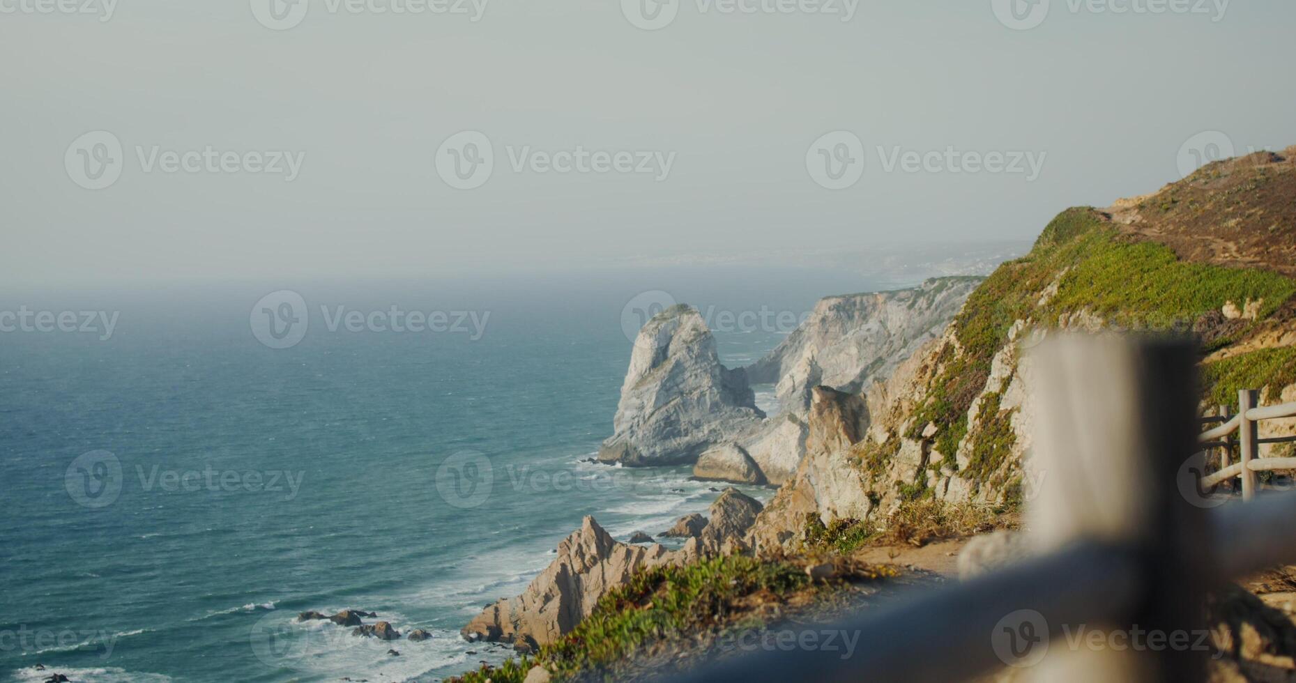 Panoramic view of sea washing the rocky shores and ledges. View from the top of the mountain from the observation deck photo