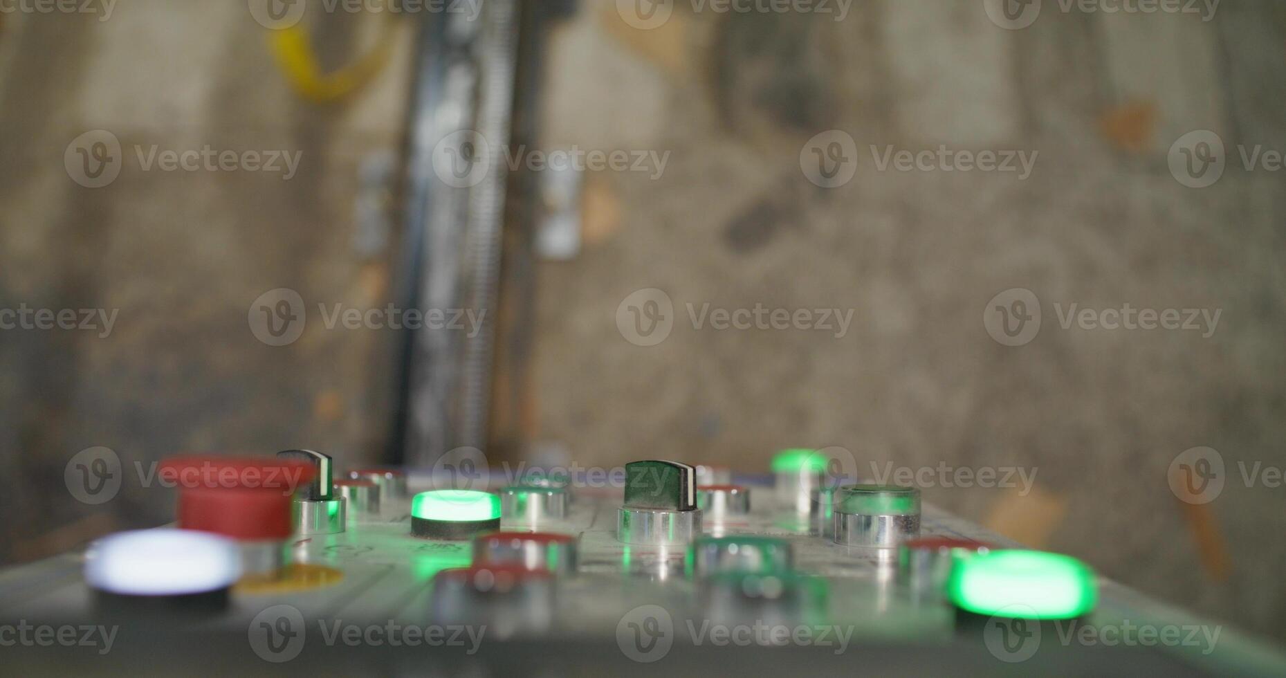 A man presses the machine control button while working in a factory. Close-up of his hands, an unrecognizable person photo