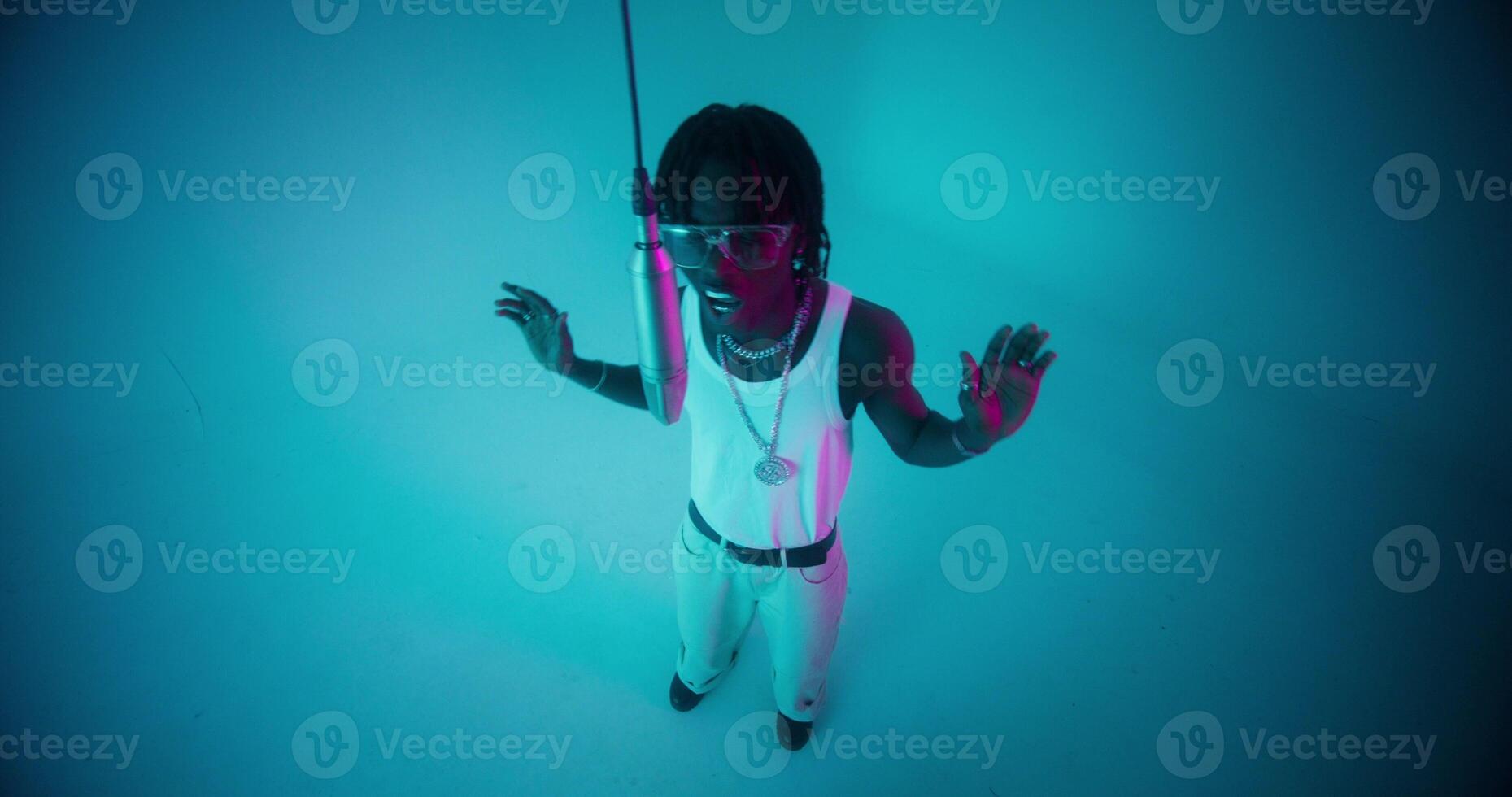 Top view of the singing and dancing rapper. photo