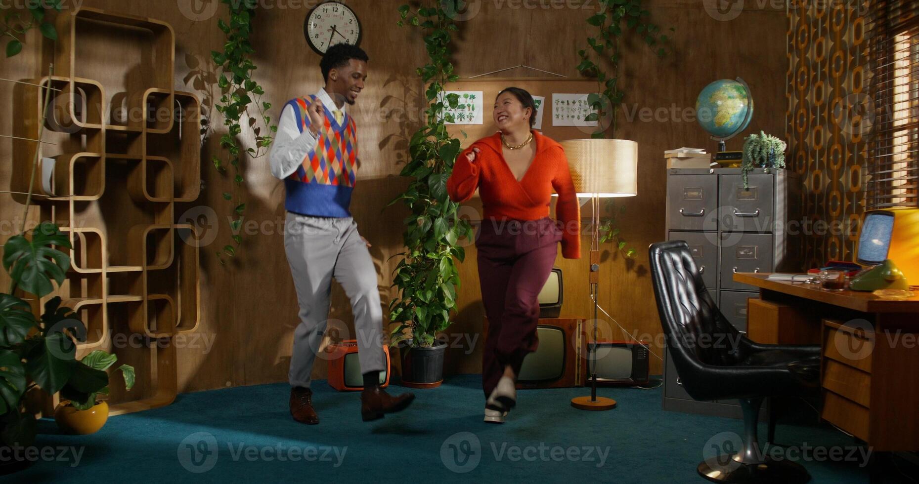 The old fashion. A man and a woman have fun and dance in a retro room photo