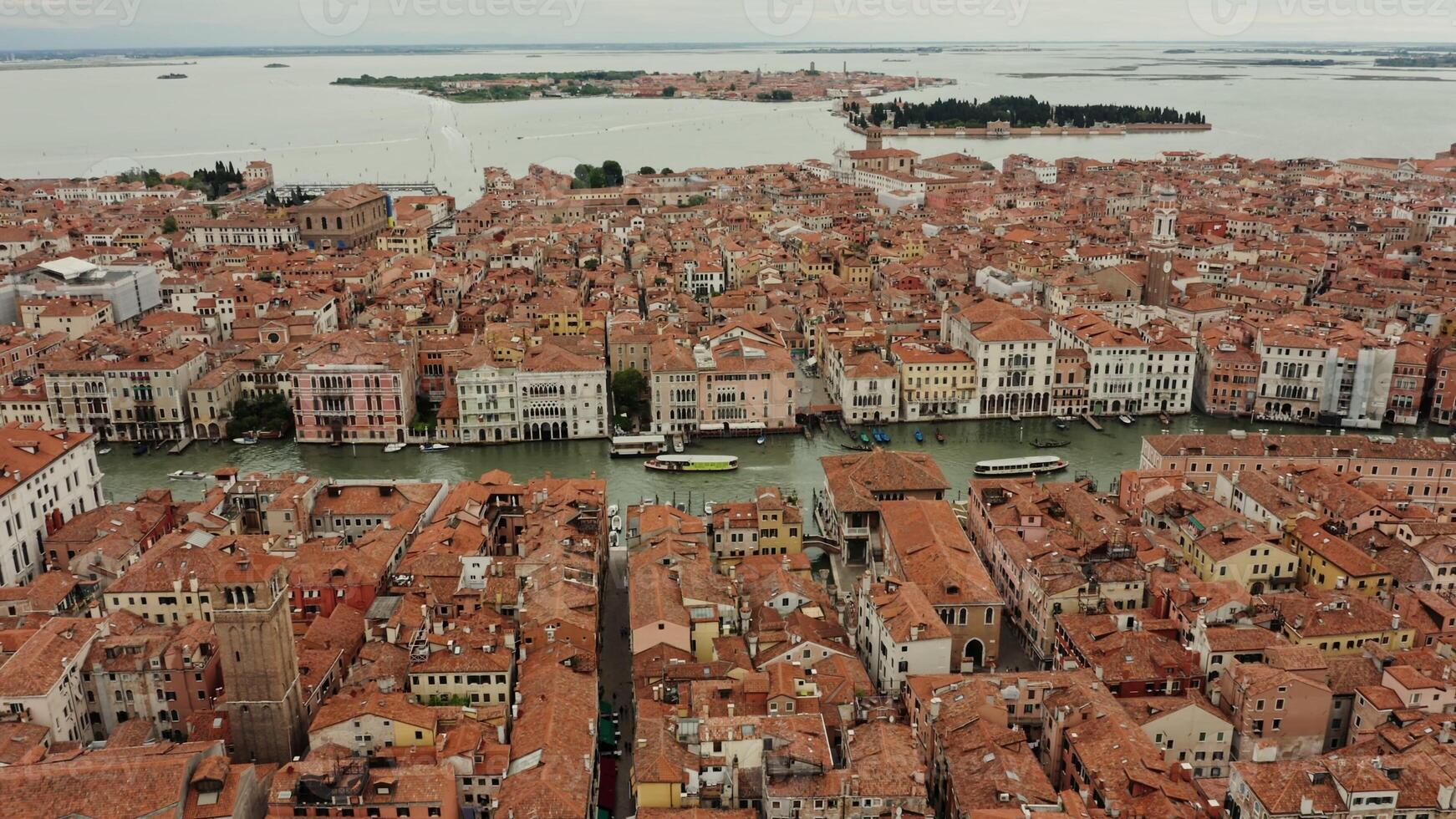 view of the beautiful Italian city on the water. Traditional houses with orange roofs from a bird's eye view. Venice, Italy photo