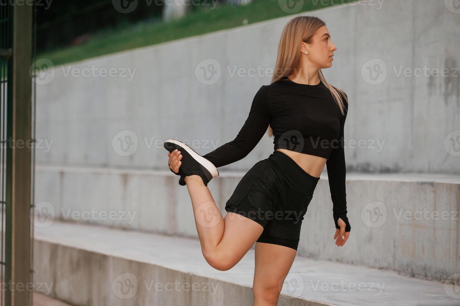 Warm, up ,exercises. Beautiful ,,fitness woman in sport clothes is outdoors photo