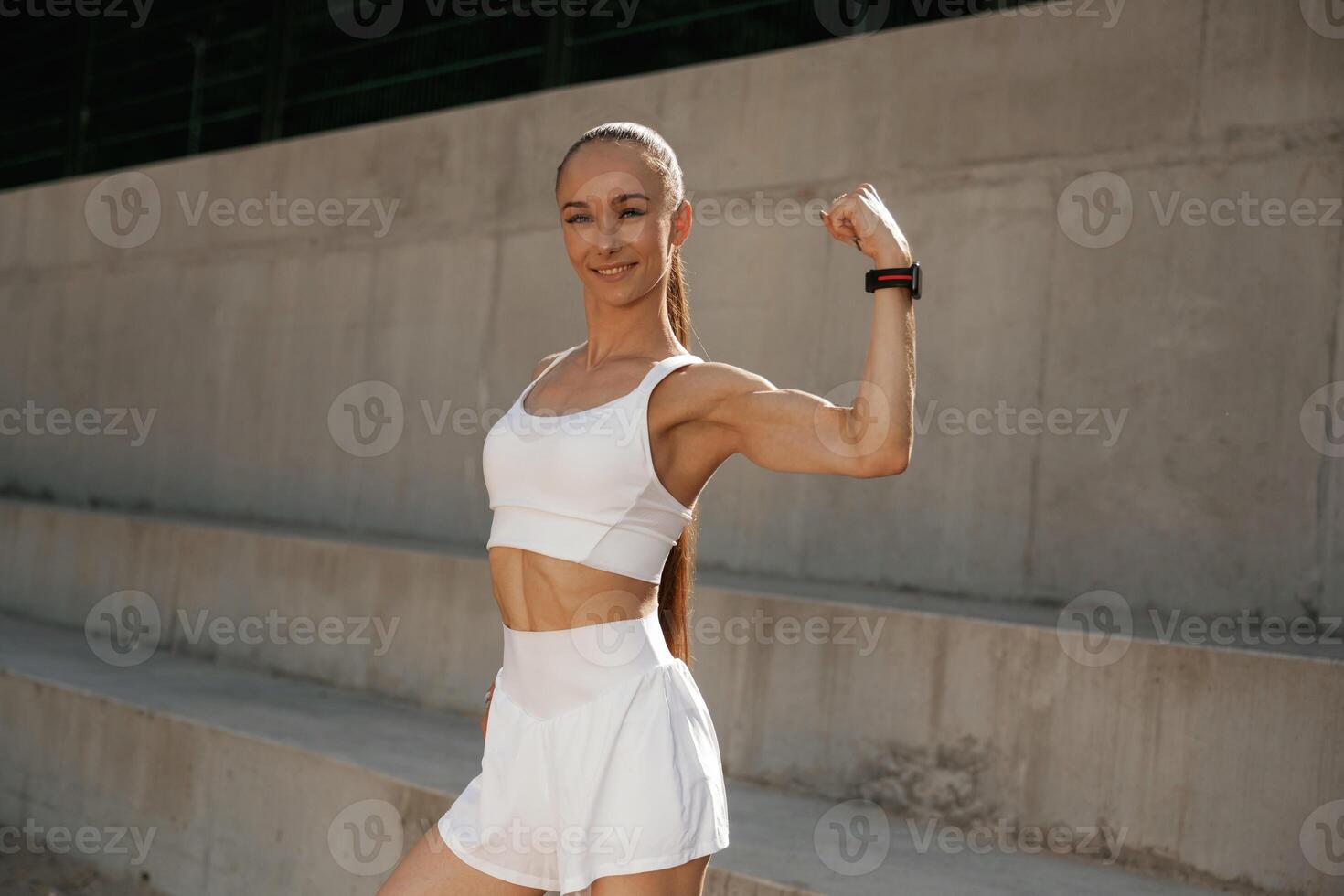 Young skinny fitness woman is outdoors., photo