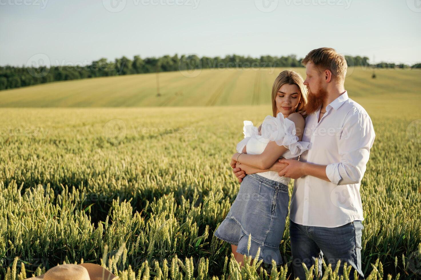 Non urban view, leisure... Lovely couple are on the green agricultural field together photo