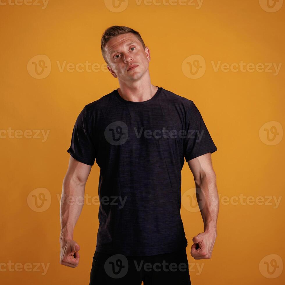 Man is against background in the studio. photo