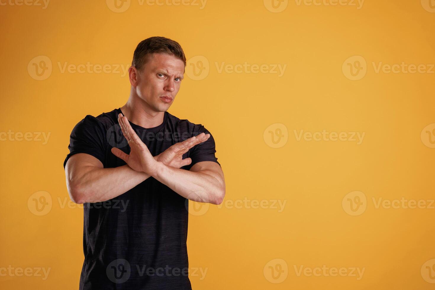 Stop, don't, hands ,gesture. ..Man is against background in the studio photo