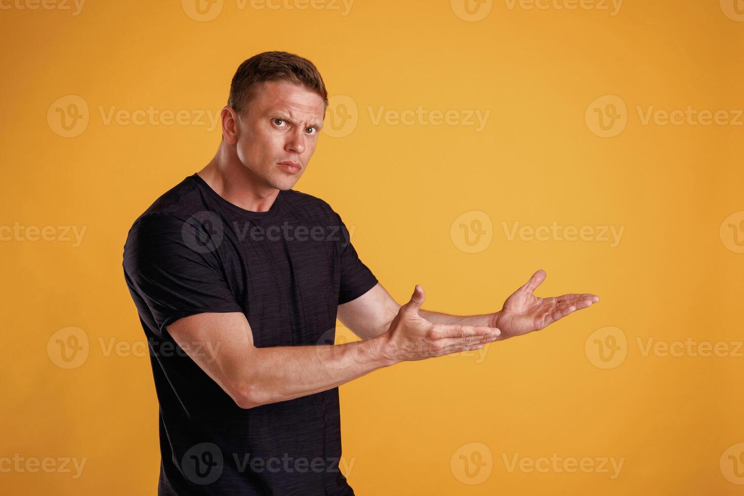 Copy space concept,,, showing,, pointing. Man is against background in the studio photo