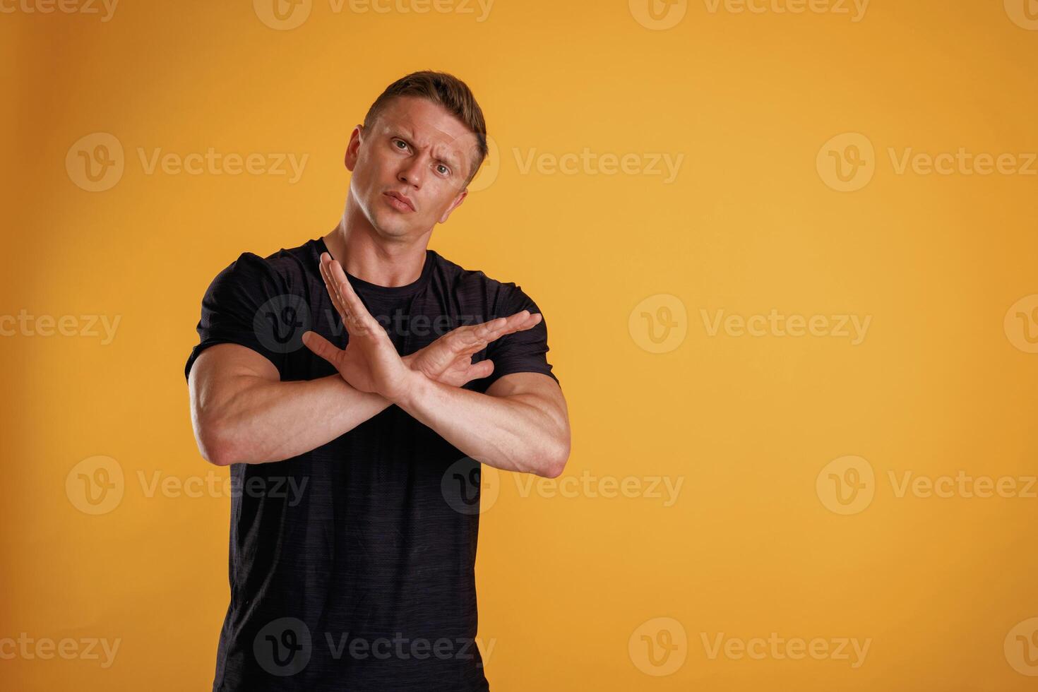 Stop, don't, hands gesture. ,Man is against background in the studio photo
