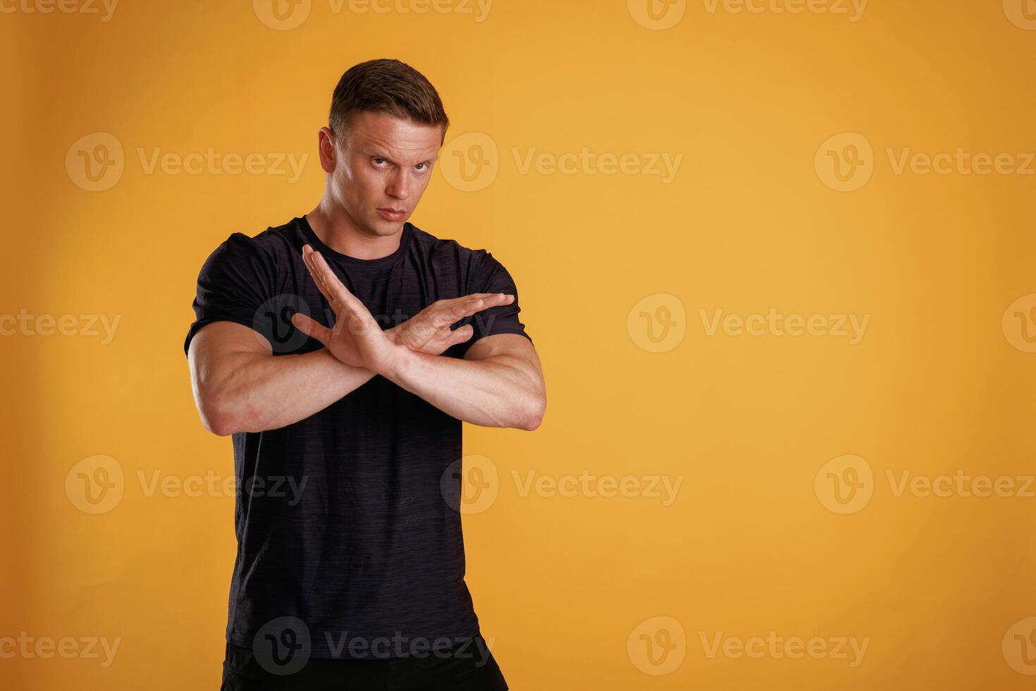 Stop,, don't,,, hands gesture. Man is against background in the studio photo