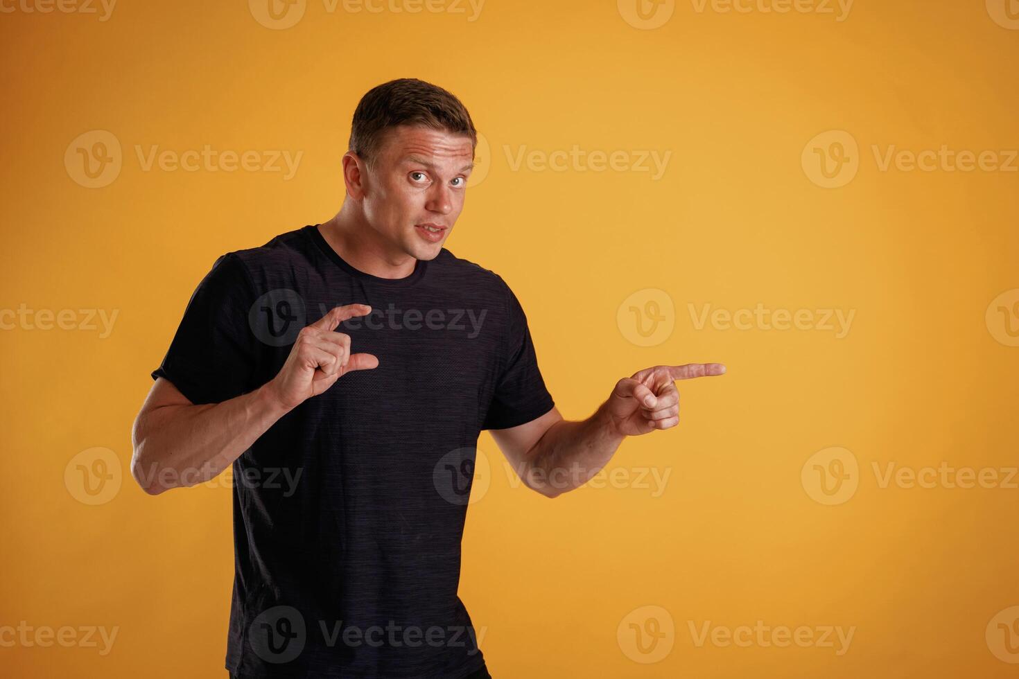 Invisible copy space,,, arms. Man is against background in the studio photo
