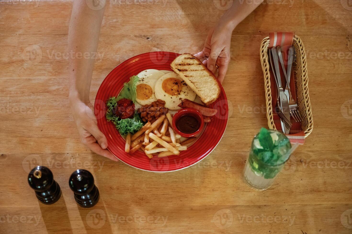 Close ,up view woman that is sitting in restaurant and eating food photo