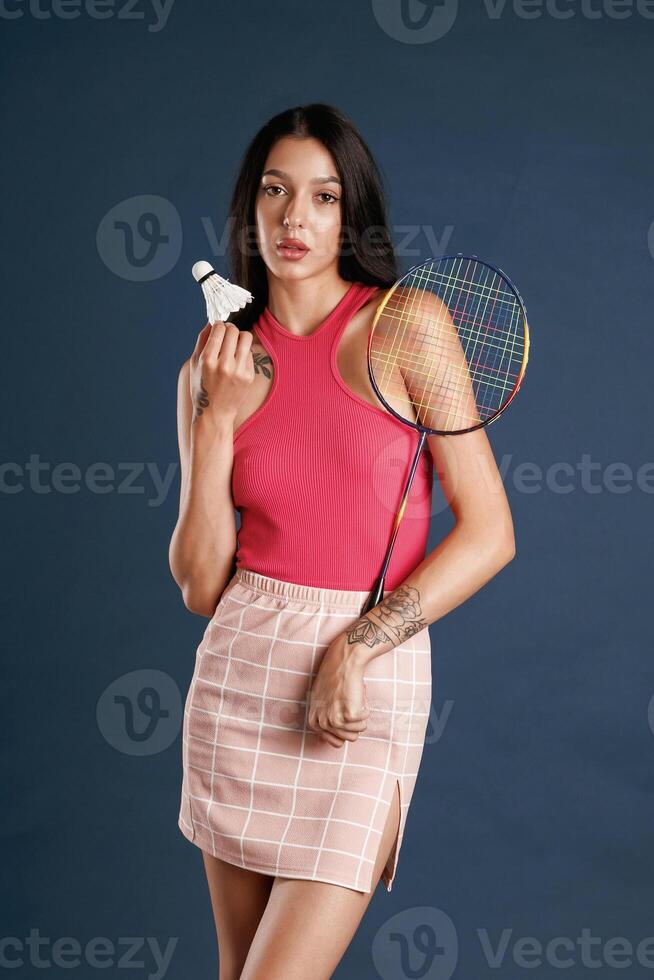 Badminton ,player... Beautiful young woman is against background photo