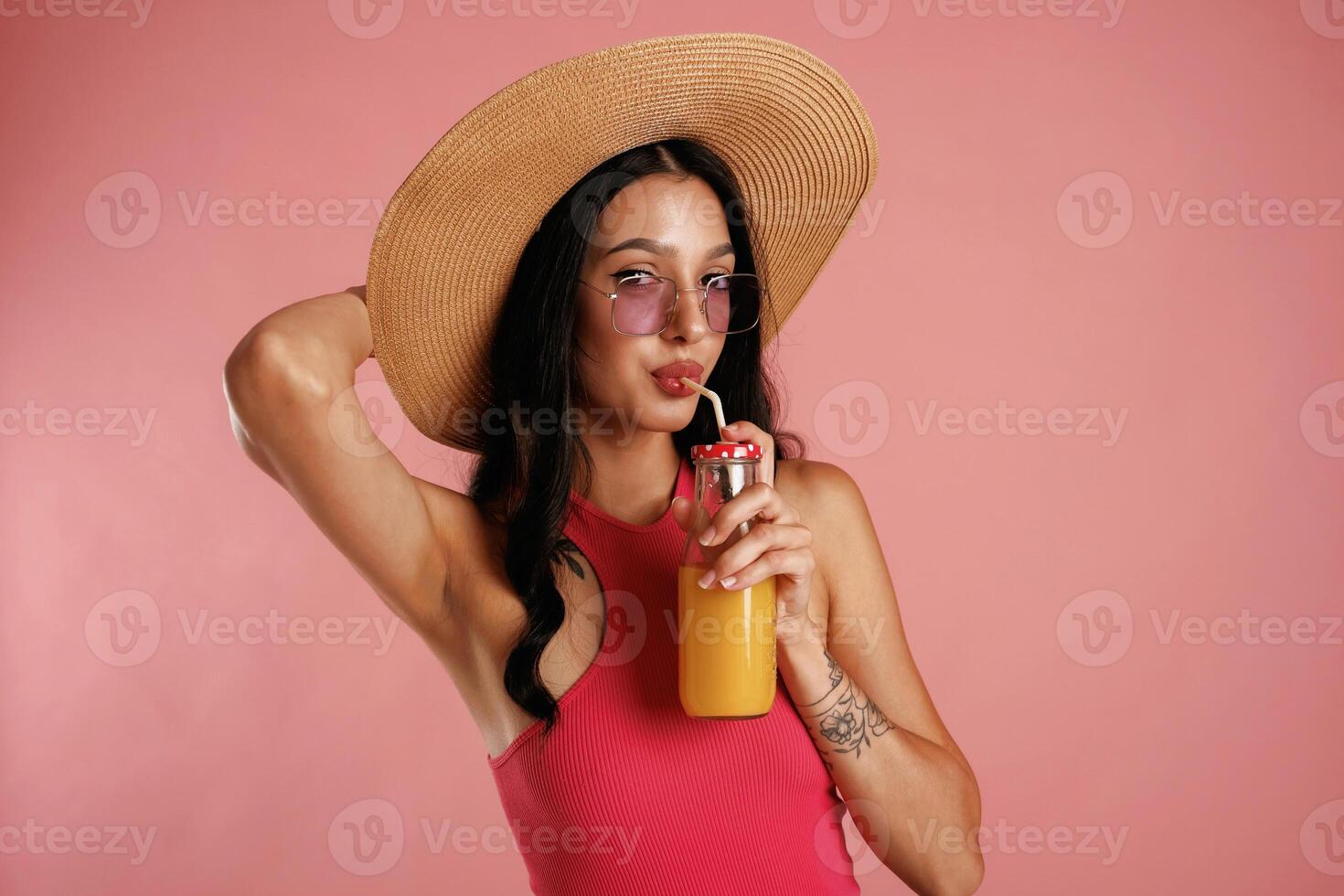 Fresh, drink. Beautiful, young woman is against background photo