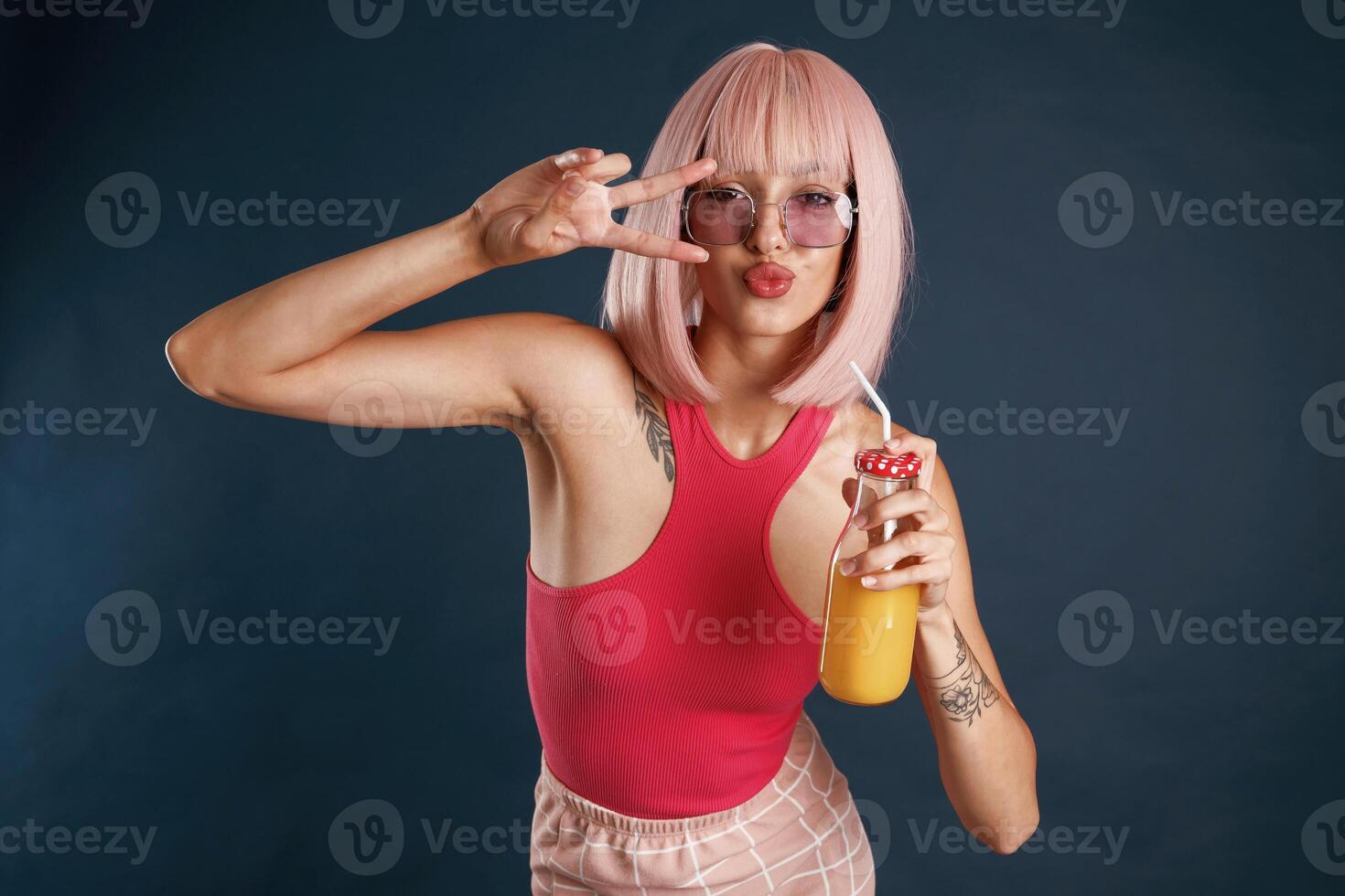 Happy,, hands and fingers gesture, cute pink hair. Beautiful young woman is against background photo