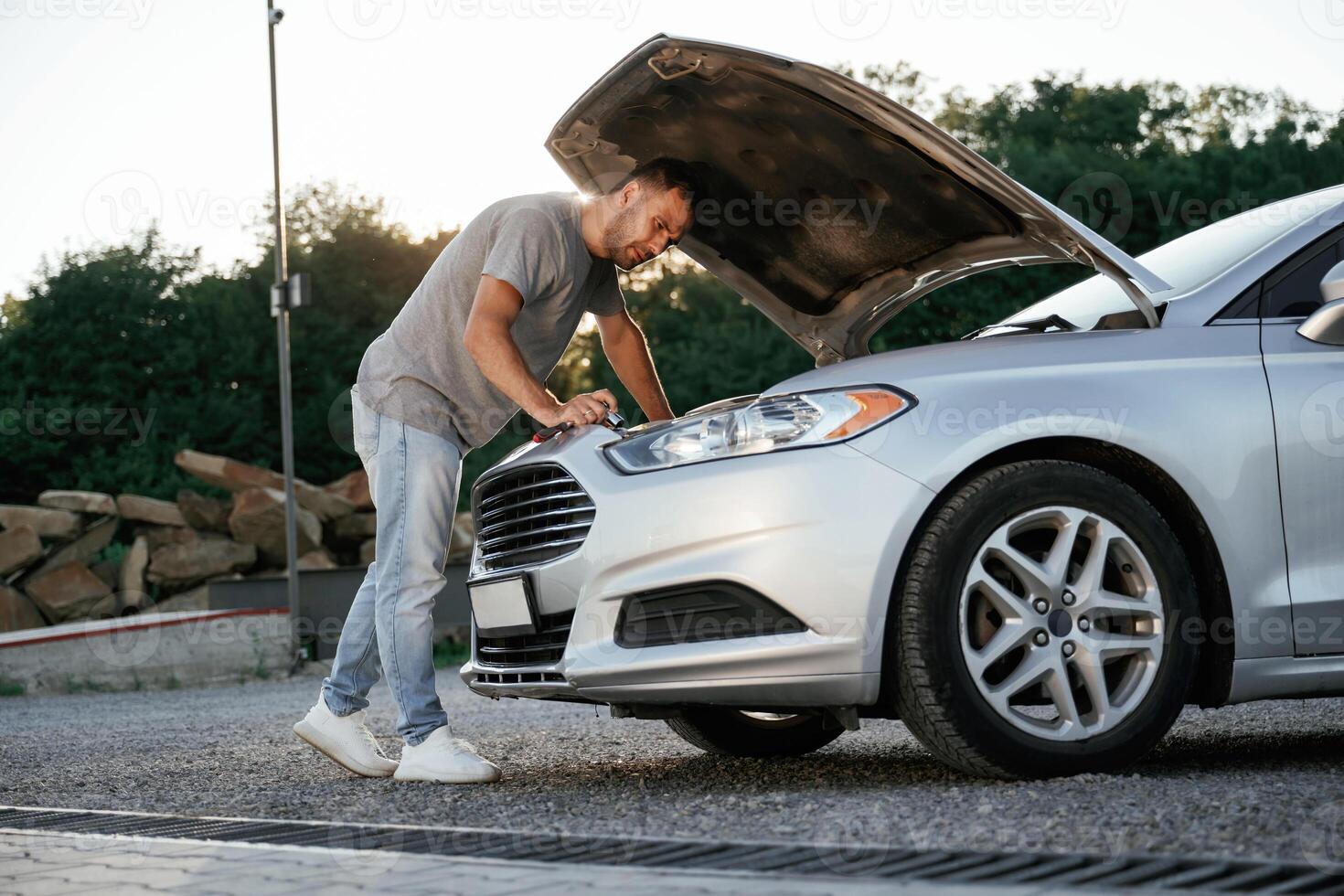 Problem,,,, fixing and repairing the broken automobile. Man is with his car outdoors photo