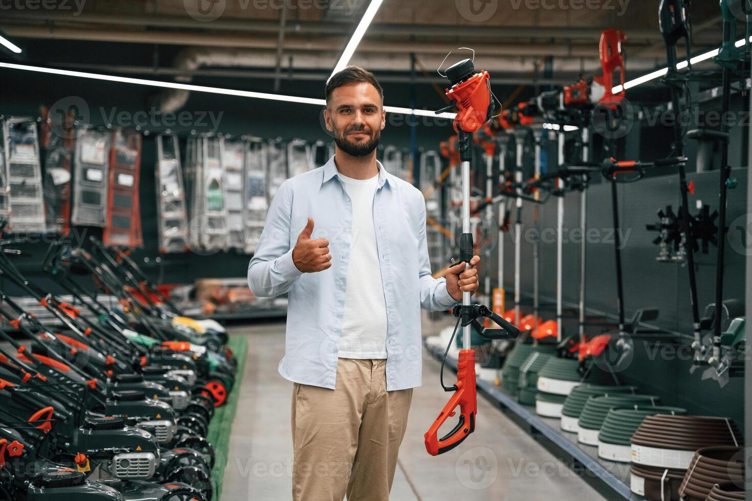 Goods, bunch ,of,, tools. Man is in the hardware shop photo