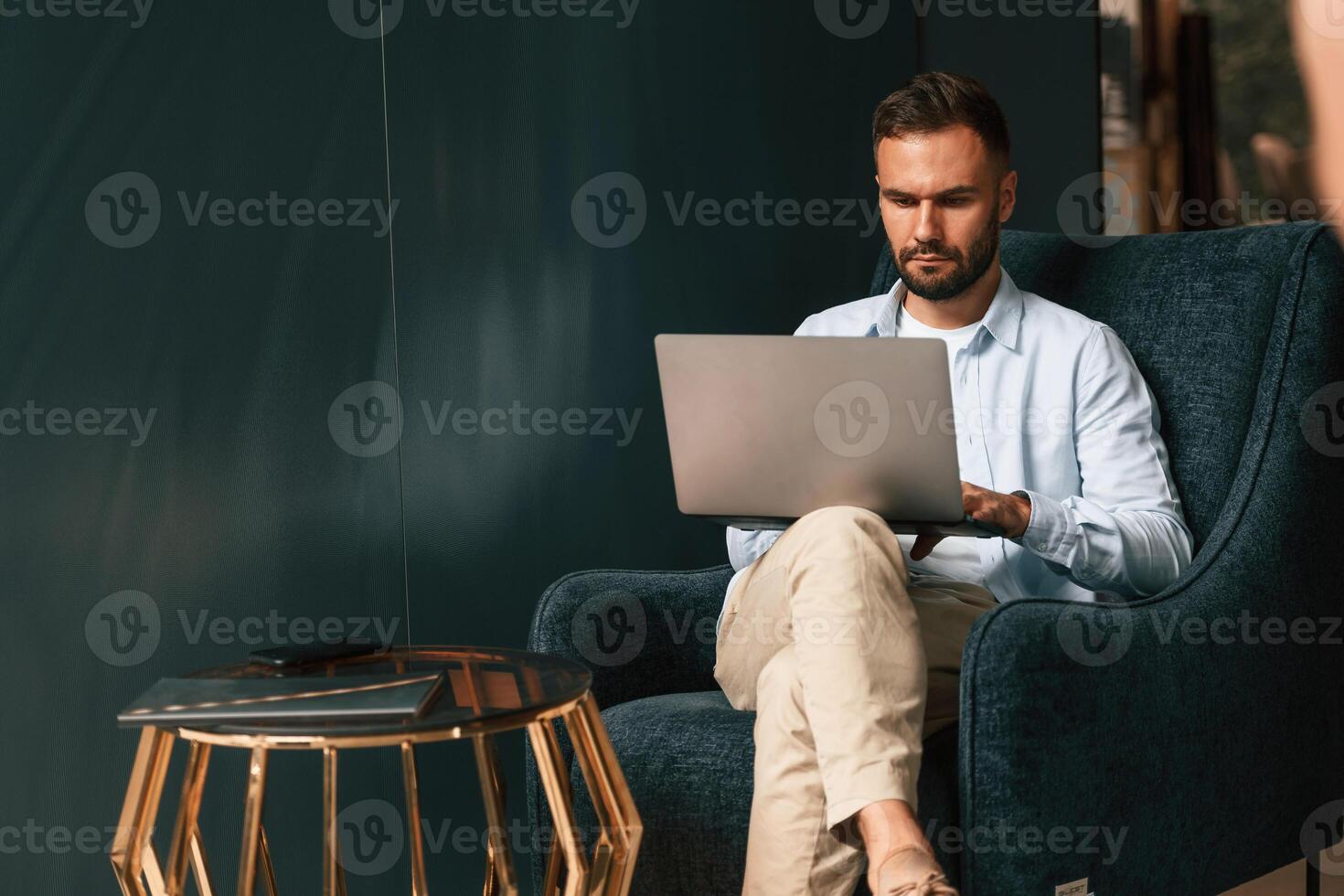 Businessman is sitting, and working by using laptop photo