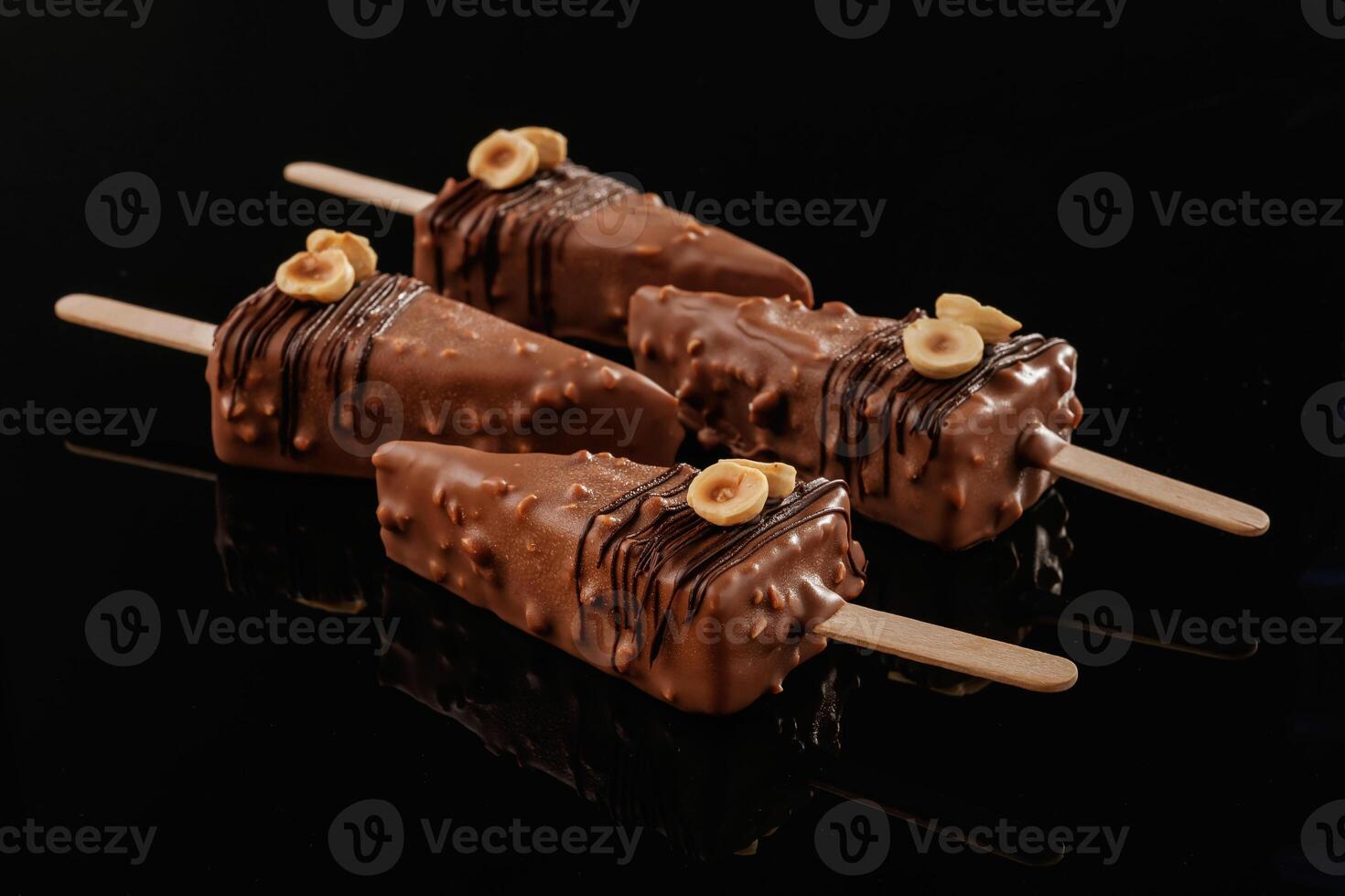 In the form of ice cream. Tasty cheesecakes on the black background photo