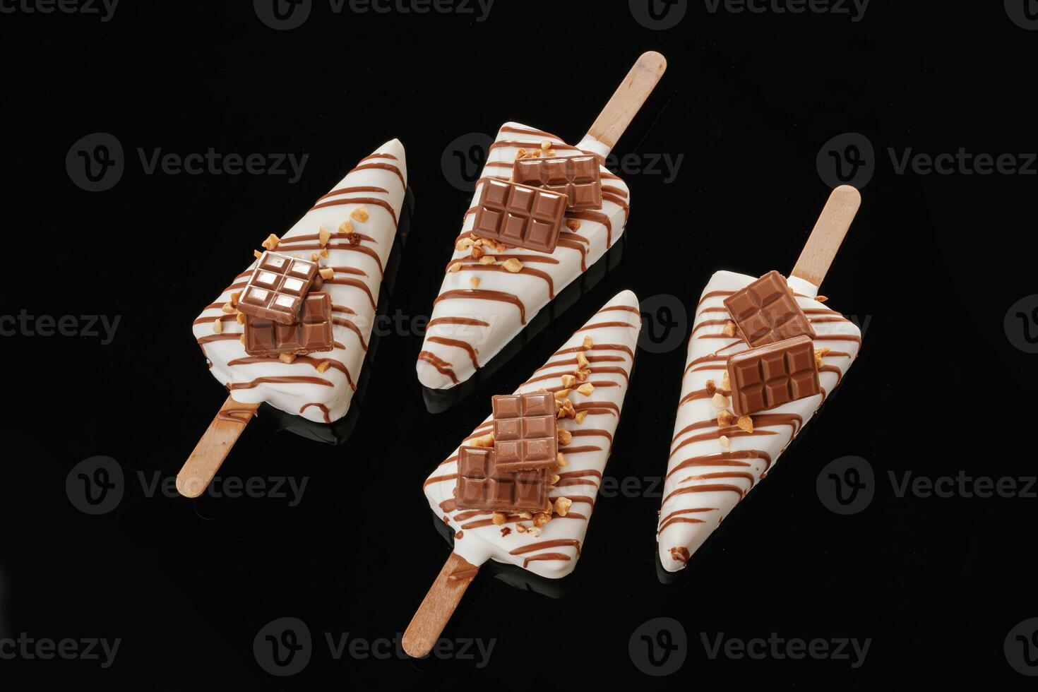 In the form of ice,, cream. Tasty ,cheesecakes on the black background photo