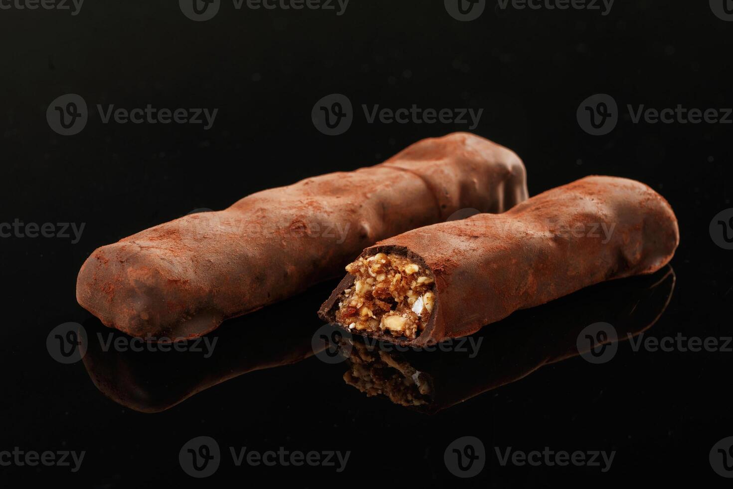 Close up view. Crispy, and ,sweet chocolate bars on black background photo