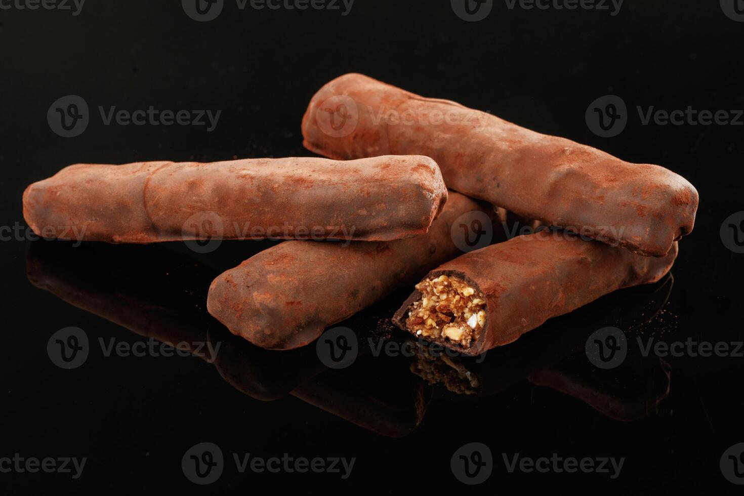 Crispy and sweet ,,chocolate bars on black background photo